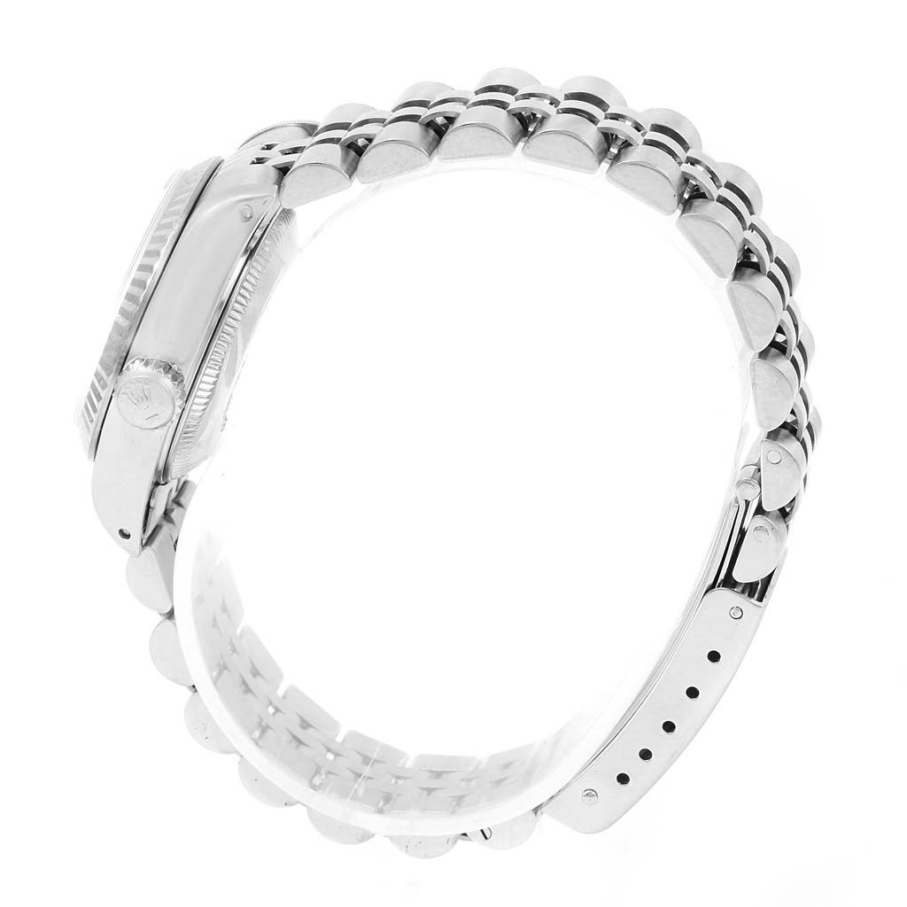 The image shows the side profile of a Rolex Datejust 69174 Women's Stainless Steel Silver Dial 69174 Women's Stainless Steel Silver Dial watch, highlighting the crown, case, and bracelet.