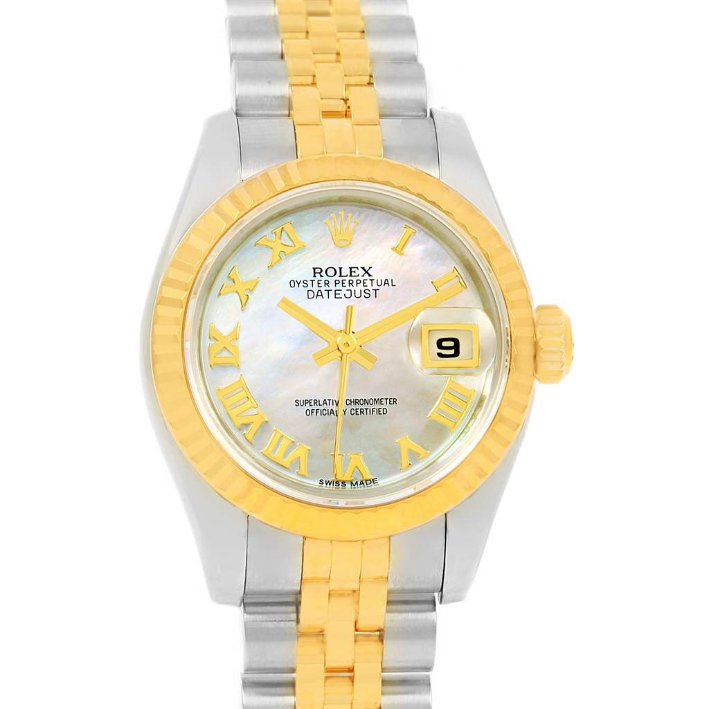 This Rolex Datejust 179173 Women's Steel and Gold (two tone) Mother of Pearl Dial 179173 Women's Steel and Gold (two tone) Mother of Pearl Dial watch is shown from a front angle, displaying its face, bezel, crown, and partial bracelet.