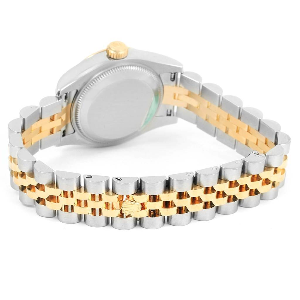 This image shows the back of the Rolex Datejust 179173 Women's Steel and Gold (two tone) Mother of Pearl Dial 179173 Women's Steel and Gold (two tone) Mother of Pearl Dial watch case and its two-tone bracelet.