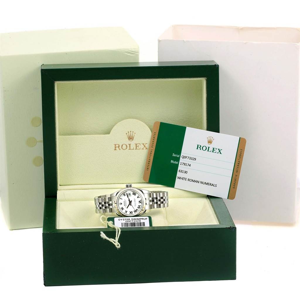 The image shows a Rolex Datejust 179174 Women's Stainless Steel White Dial 179174 Women's Stainless Steel White Dial watch in its open green and cream box with the warranty card displayed.