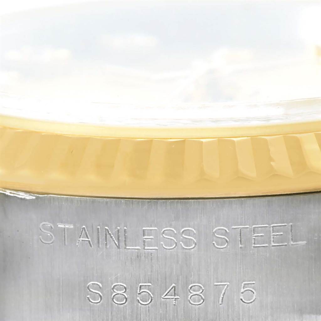 This close-up image shows the stainless steel case and fluted bezel of a Rolex Datejust 69173 Women's Stainless Steel Champagne Dial 69173 Women's Stainless Steel Champagne Dial watch.