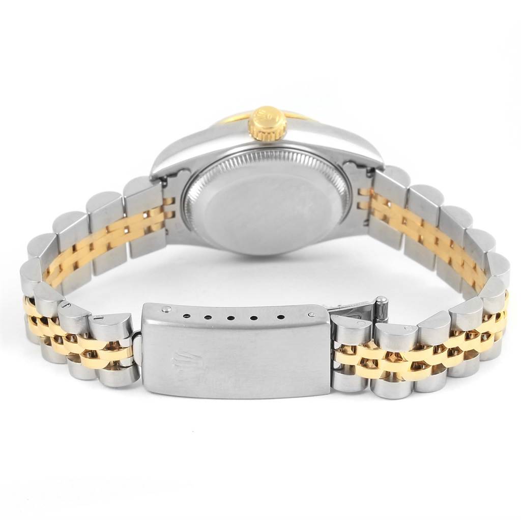 A rear view of the Rolex Datejust 69173 Women's Stainless Steel Champagne Dial 69173 Women's Stainless Steel Champagne Dial watch showing the case back, crown, and two-tone Jubilee bracelet with the clasp.