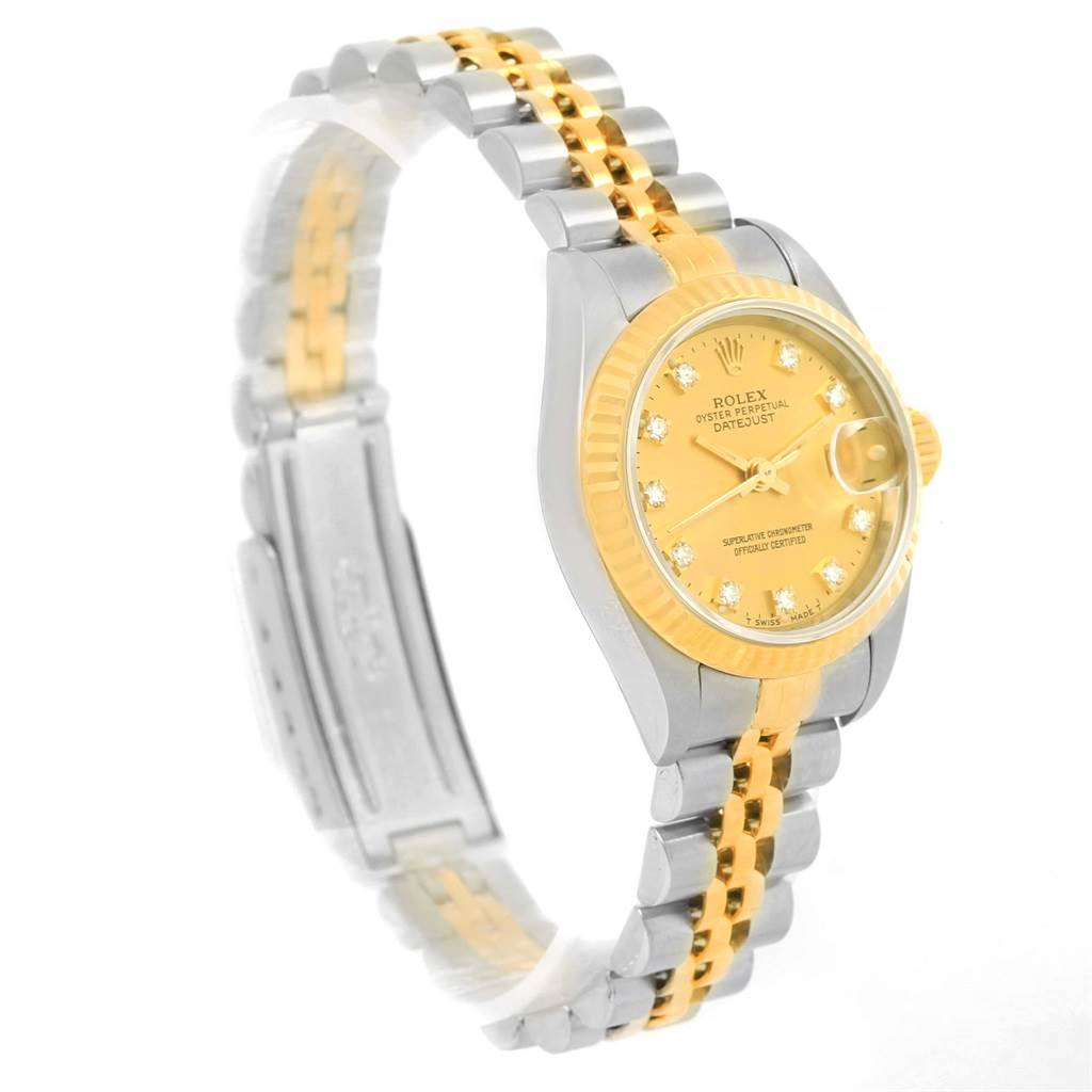 The Rolex Datejust 69173 Women's Stainless Steel Champagne Dial 69173 Women's Stainless Steel Champagne Dial watch is shown at a side angle, highlighting its yellow-gold dial, bezel, and two-tone bracelet.