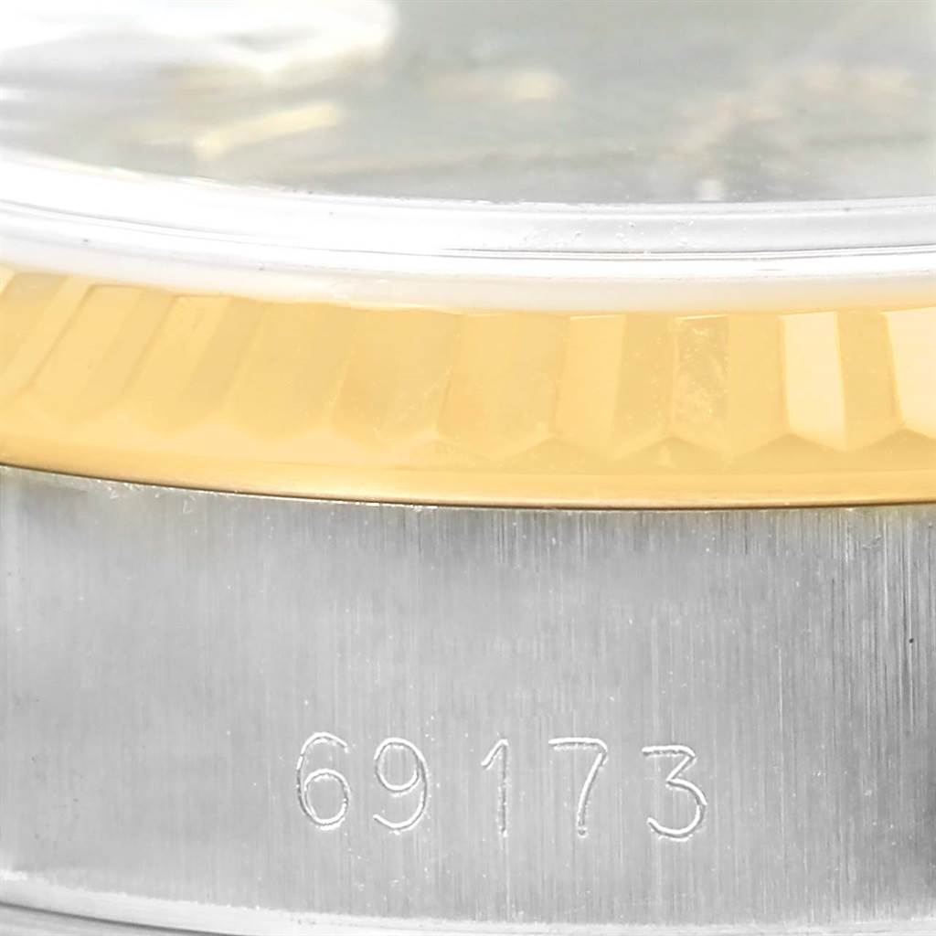 This close-up image shows the model number and fluted bezel of a Rolex Datejust 69173 Women's Stainless Steel Grey Dial 69173 Women's Stainless Steel Grey Dial watch.