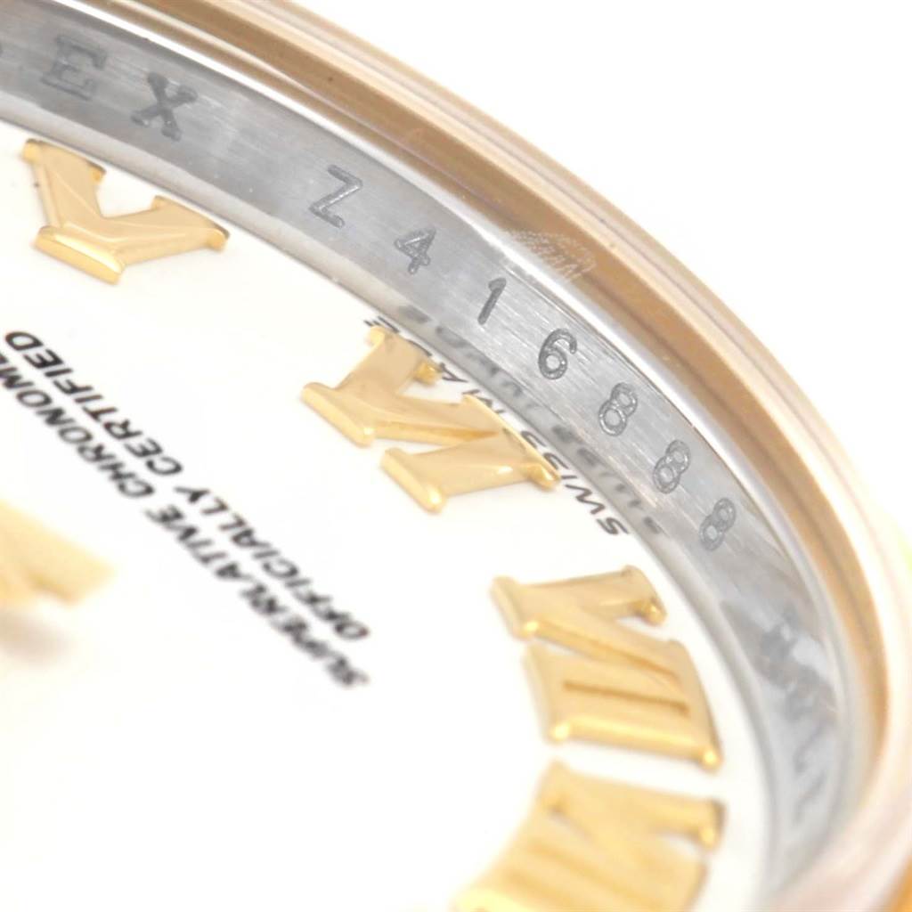 The image shows a close-up of the dial and inner bezel with a partial view of the serial number of a Rolex Datejust 179173 Women's Steel and Gold (two tone) White Dial 179173 Women's Steel and Gold (two tone) White Dial watch.