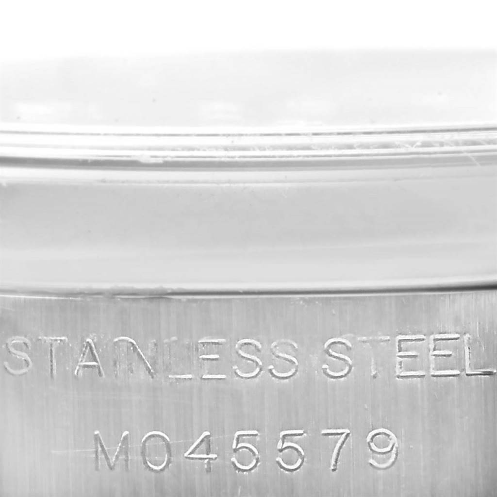 The image shows a close-up of the serial number engraving on the stainless steel case of a Rolex Datejust 179160 Women's Stainless Steel White Dial 179160 Women's Stainless Steel White Dial watch.