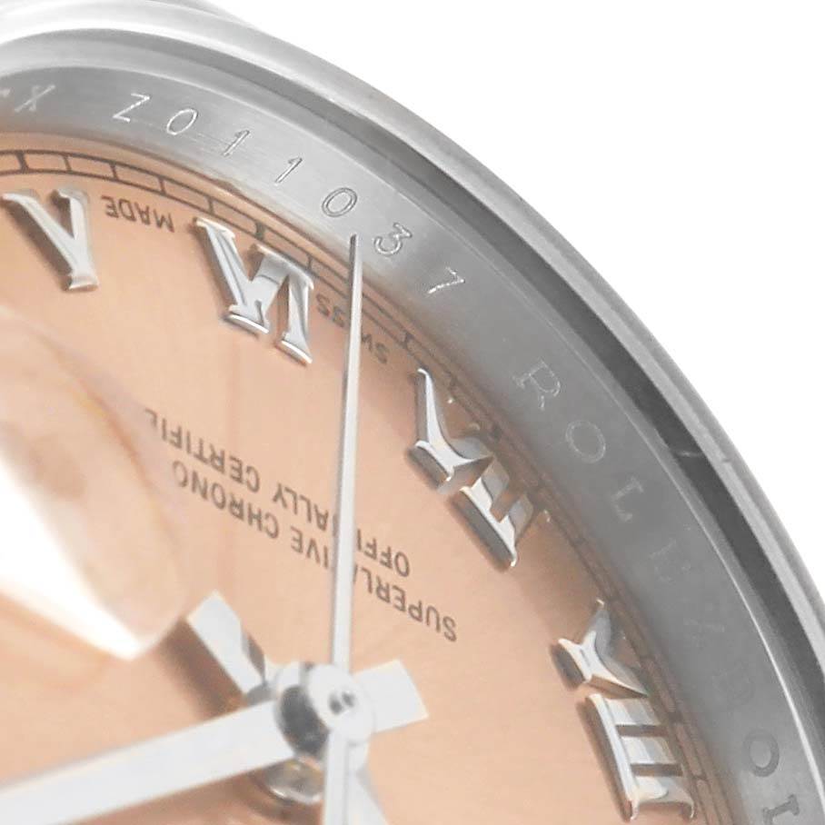 The image shows a close-up angle of the Rolex Datejust 179160 Women's Stainless Steel Pink Dial 179160 Women's Stainless Steel Pink Dial watch, focusing on the dial, bezel, and part of the serial number.