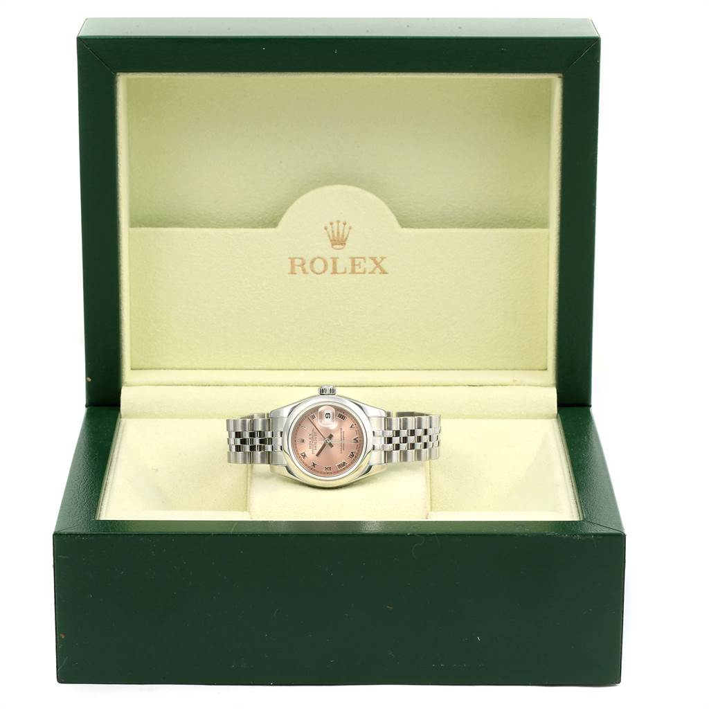 The Rolex Datejust 179160 Women's Stainless Steel Pink Dial 179160 Women's Stainless Steel Pink Dial watch is displayed frontally inside an open green and cream Rolex box.