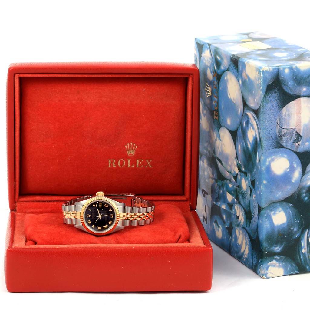 The Rolex Datejust 69173 Women's Stainless Steel Black Dial 69173 Women's Stainless Steel Black Dial watch is shown from the front, resting in its open red case with the box beside it.