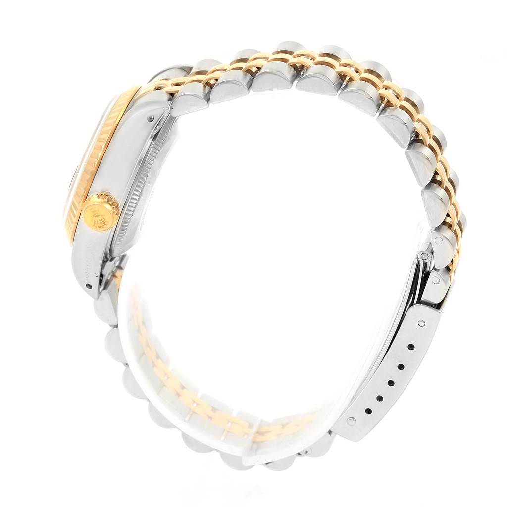 The image shows a side view of a Rolex Datejust 69173 Women's Stainless Steel Black Dial 69173 Women's Stainless Steel Black Dial watch, highlighting the crown, case, and two-tone Jubilee bracelet.