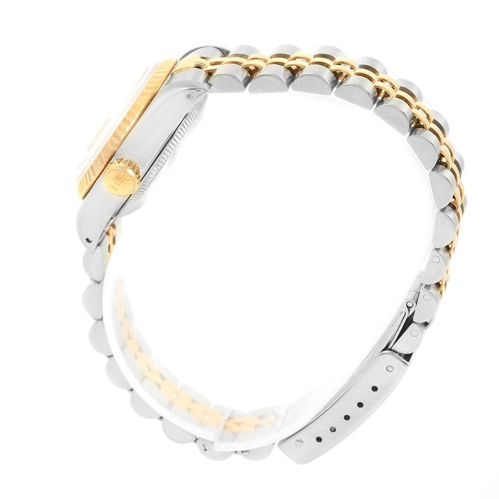 This Rolex Datejust 69173 Women's Stainless Steel Champagne Dial 69173 Women's Stainless Steel Champagne Dial watch is shown from the side, highlighting its two-tone bracelet, crown, and fluted bezel.