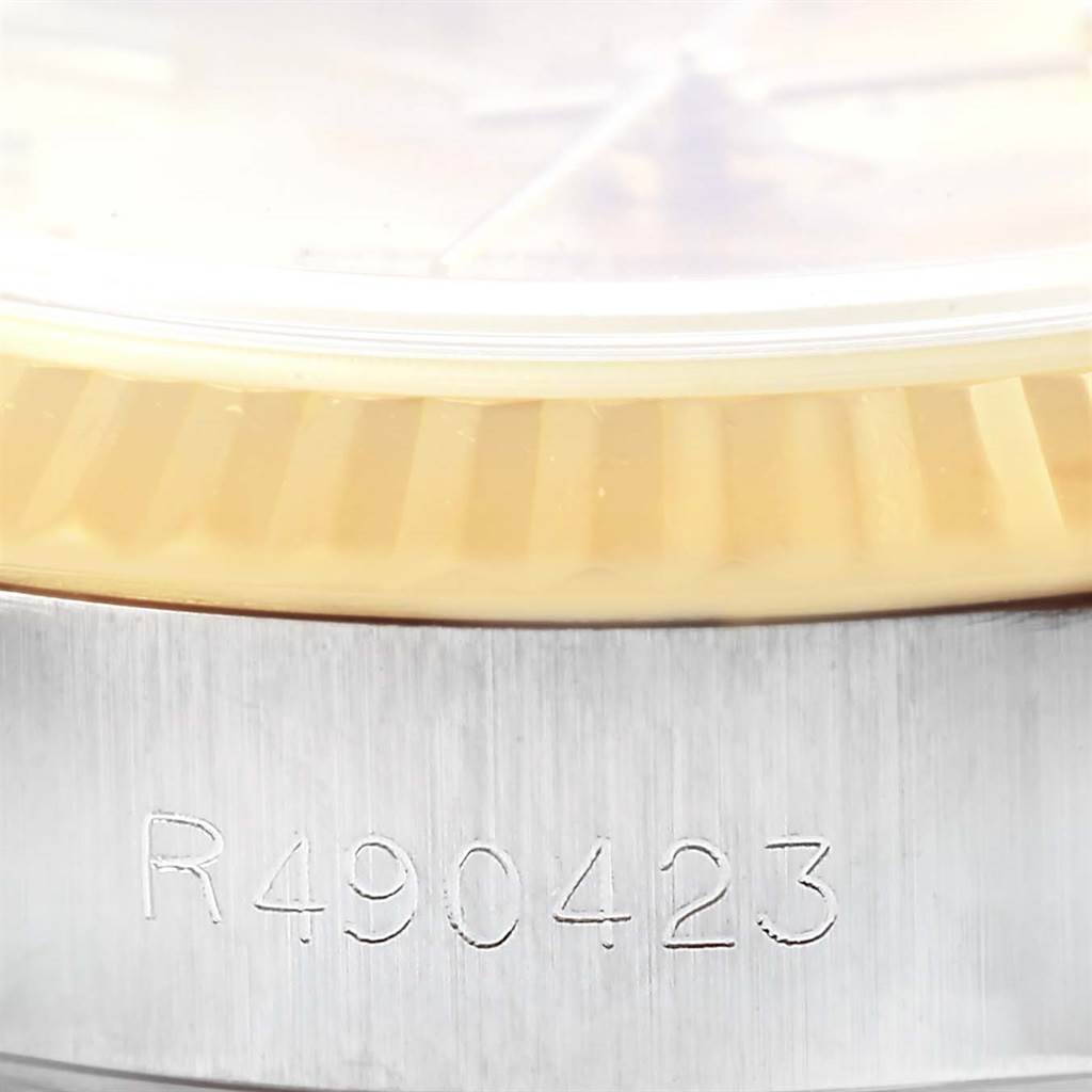 This close-up image shows the serial number and part of the bezel on a Rolex Datejust 69173 Women's Stainless Steel Champagne Dial 69173 Women's Stainless Steel Champagne Dial watch.