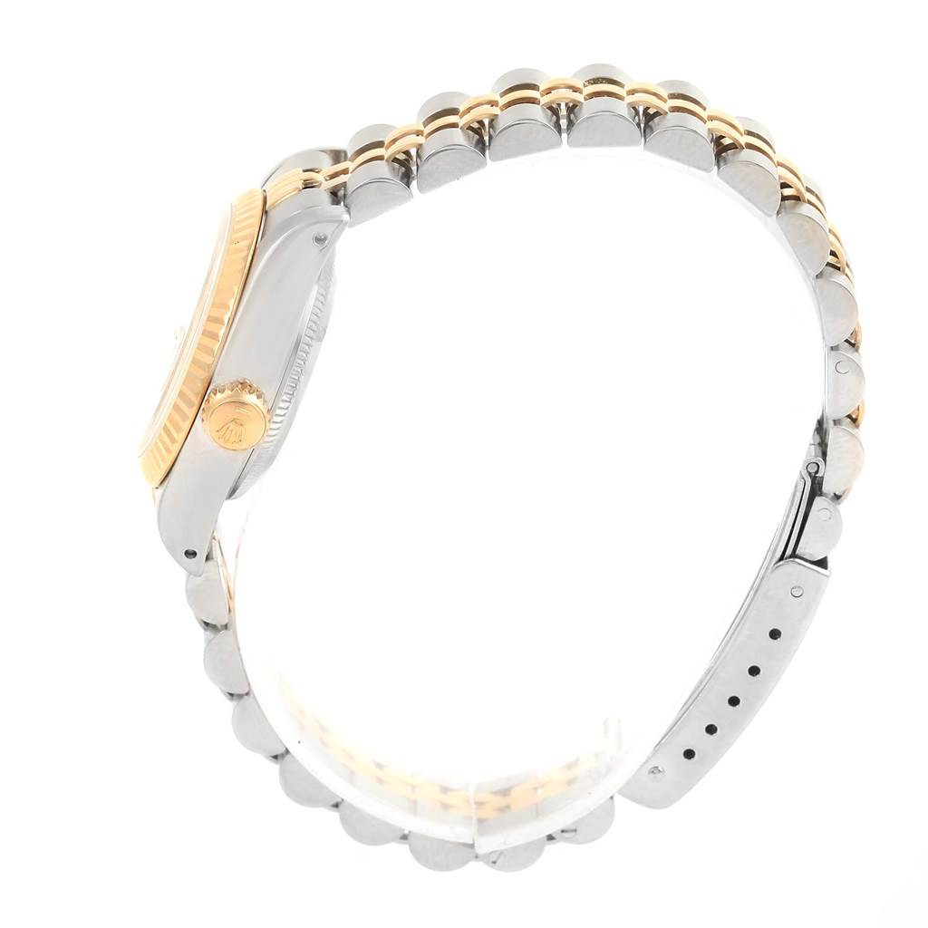 The image shows a side view of a Rolex Datejust 69173 Women's Stainless Steel Champagne Dial 69173 Women's Stainless Steel Champagne Dial watch, focusing on its case, crown, bezel, and part of the bracelet.