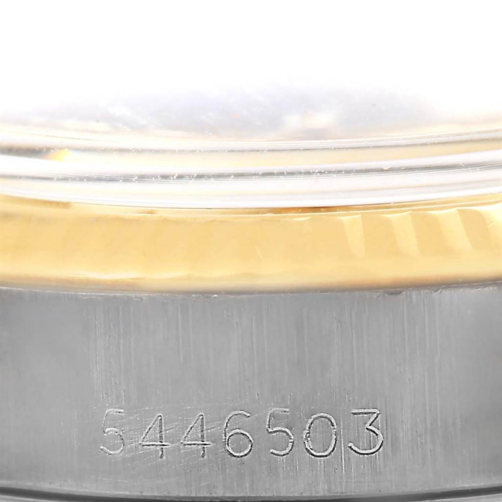 The image shows a close-up of the bezel and serial number of a Rolex Datejust 6917 Women's Stainless Steel Champagne Dial 6917 Women's Stainless Steel Champagne Dial watch.
