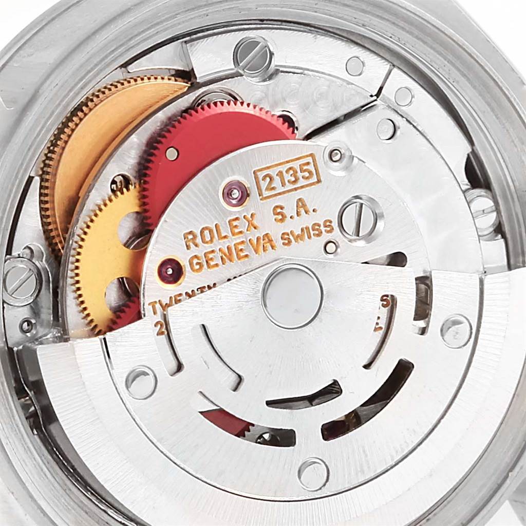 This image shows the internal mechanism of a Rolex Datejust 69174 Women's Stainless Steel Blue Dial 69174 Women's Stainless Steel Blue Dial watch, specifically the rotor and gears.