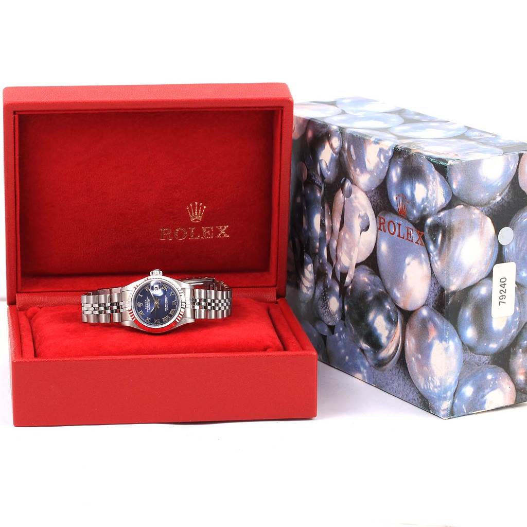 The Rolex Datejust 69174 Women's Stainless Steel Blue Dial 69174 Women's Stainless Steel Blue Dial watch is shown from the front, inside its red presentation box with the outer packaging visible.