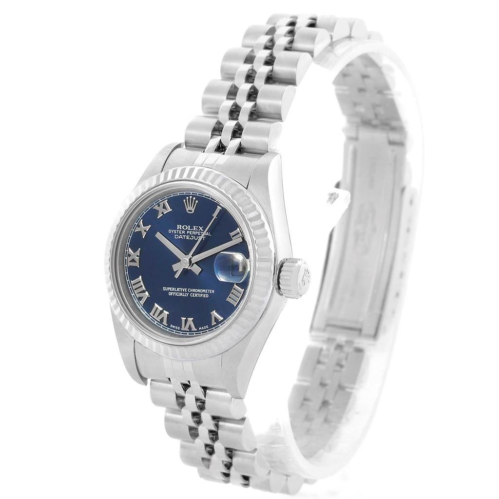 The Rolex Datejust 69174 Women's Stainless Steel Blue Dial 69174 Women's Stainless Steel Blue Dial watch is shown at an angled view, highlighting its blue dial, fluted bezel, crown, and Jubilee bracelet.