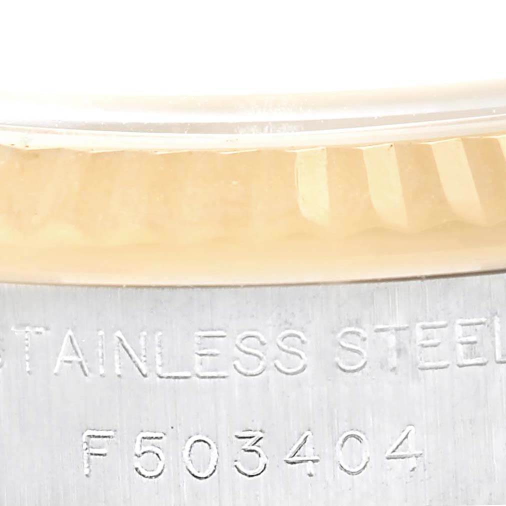 Close-up of the side of the Rolex Datejust 179173 Women's Steel and Gold (two tone) Blue Dial 179173 Women's Steel and Gold (two tone) Blue Dial watch case, showing the fluted bezel and "Stainless Steel" engraving.