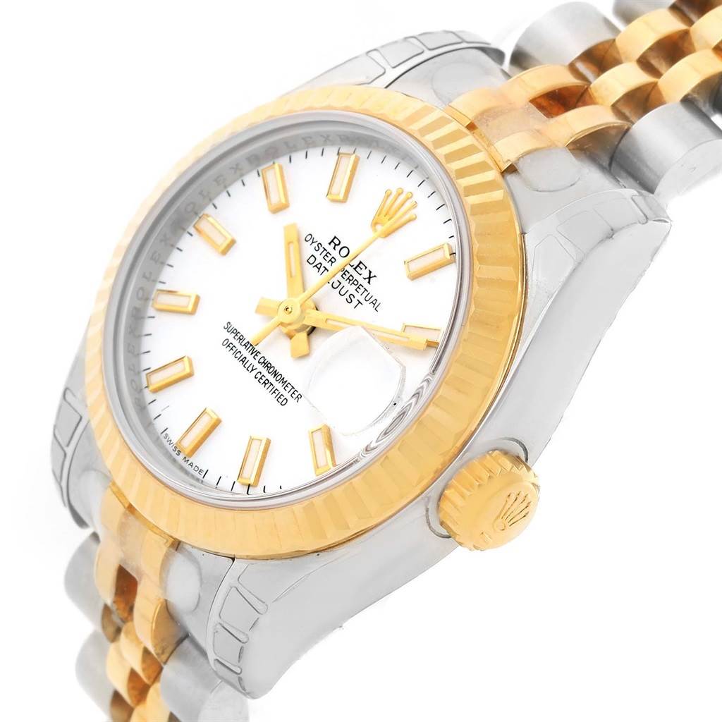The image shows a close-up angle of the Rolex Datejust 179173 Women's Steel and Gold (two tone) White Dial 179173 Women's Steel and Gold (two tone) White Dial watch's face, crown, and part of its two-tone bracelet.