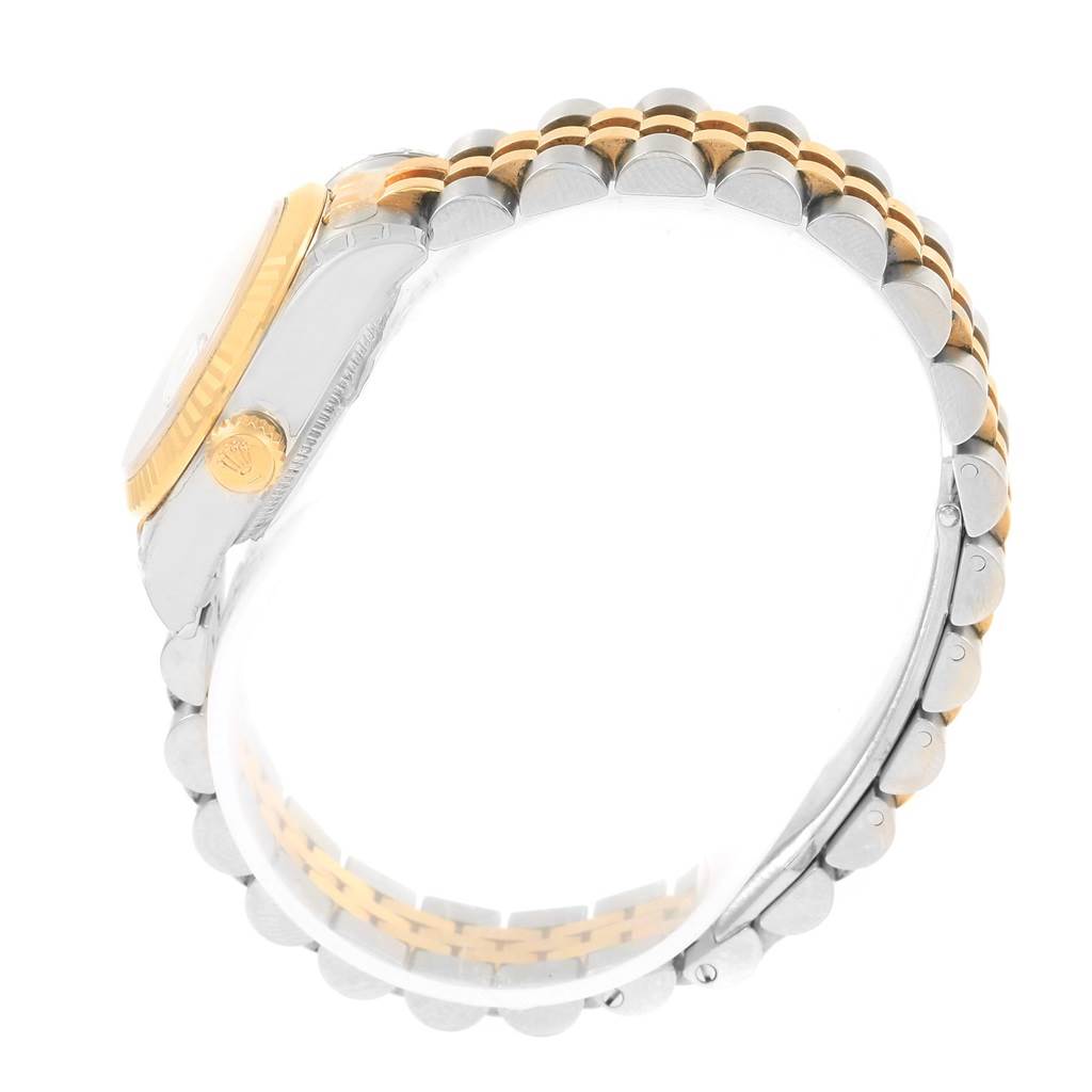 The image shows a side view of the Rolex Datejust 179173 Women's Steel and Gold (two tone) White Dial 179173 Women's Steel and Gold (two tone) White Dial watch, highlighting the crown and two-tone bracelet.