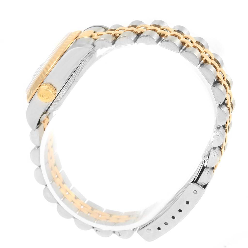 This image shows the side and part of the band of a Rolex Datejust 79173 Women's Stainless Steel Silver Dial 79173 Women's Stainless Steel Silver Dial watch, focusing on the case and the two-tone bracelet.