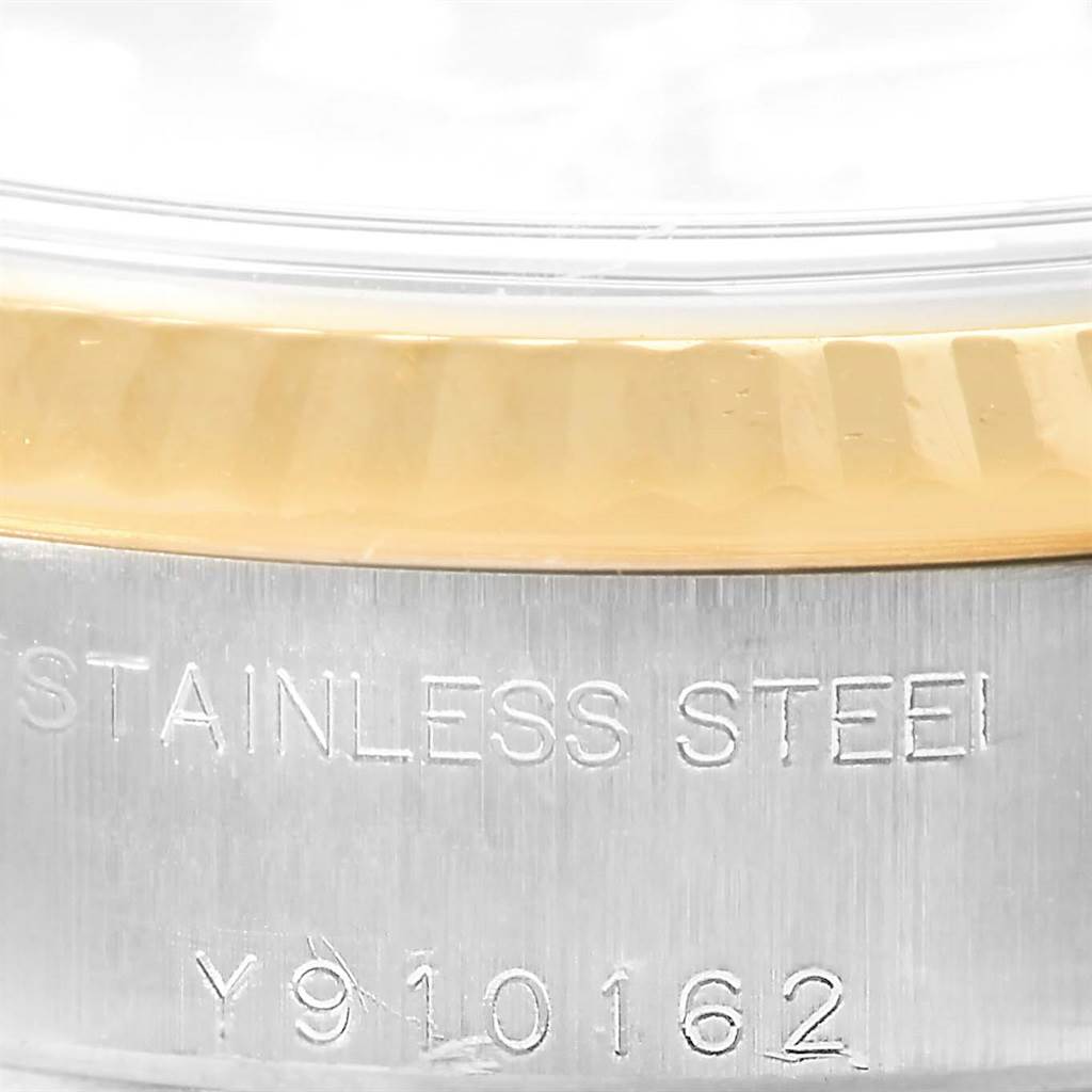 This image shows a close-up of the stainless steel and gold bezel with serial number engraving on a Rolex Datejust 79173 Women's Stainless Steel Silver Dial 79173 Women's Stainless Steel Silver Dial watch.