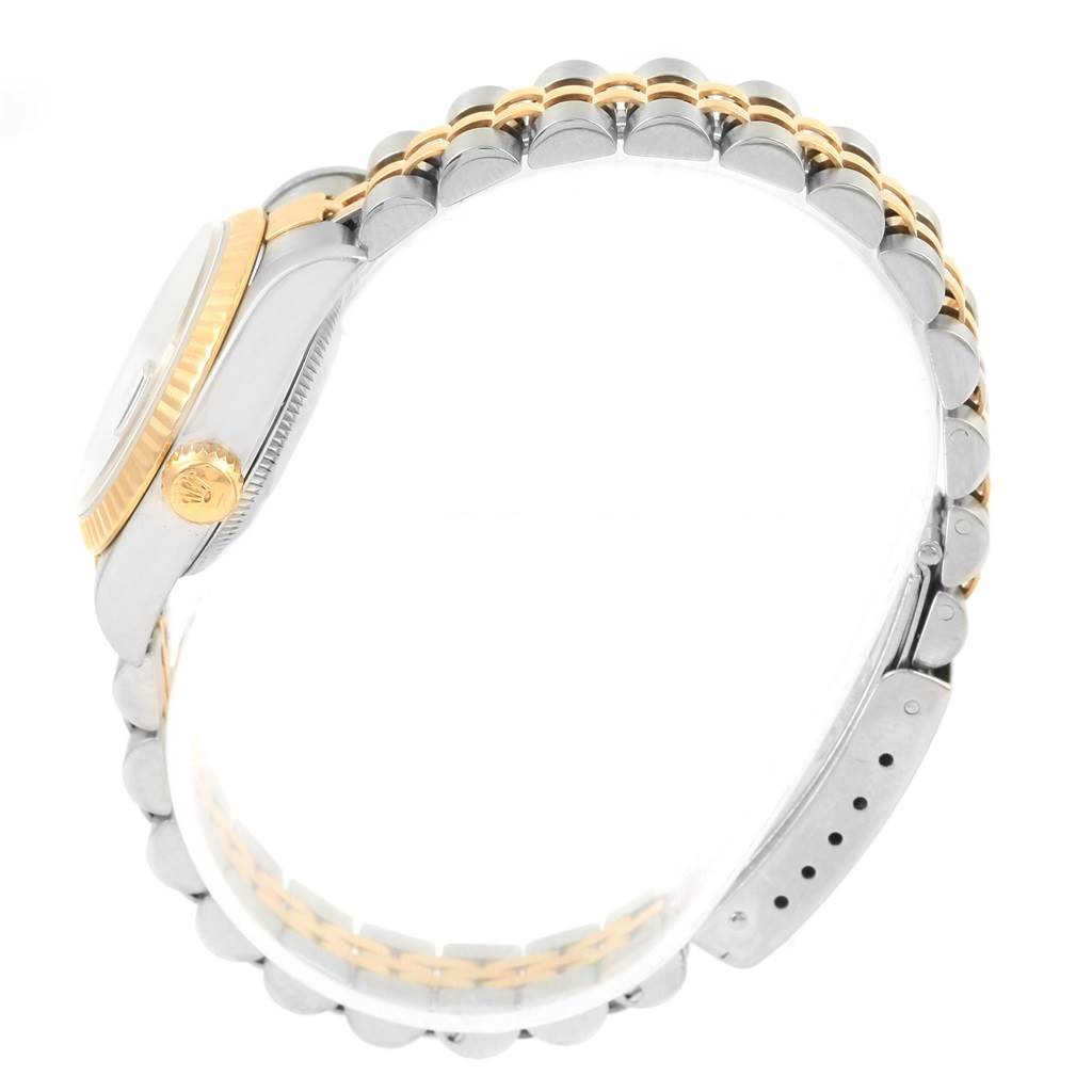 This image shows a side view of a Rolex Datejust 79173 Women's Steel and Gold (two tone) Black Dial 79173 Women's Steel and Gold (two tone) Black Dial watch, highlighting the crown, case, and the two-tone bracelet.