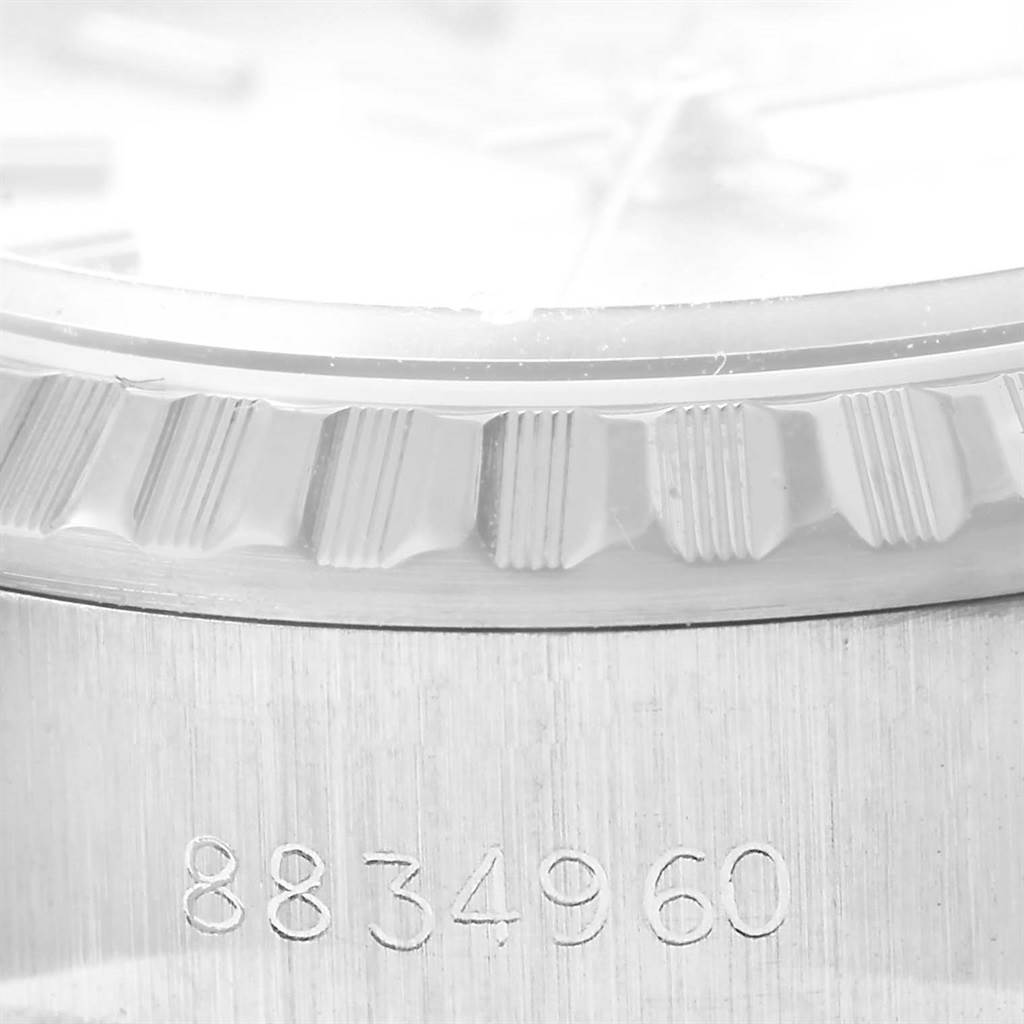 The image shows a close-up of the bezel and case edge with the serial number of a Rolex Datejust 69240 Women's Stainless Steel Silver Dial 69240 Women's Stainless Steel Silver Dial watch.