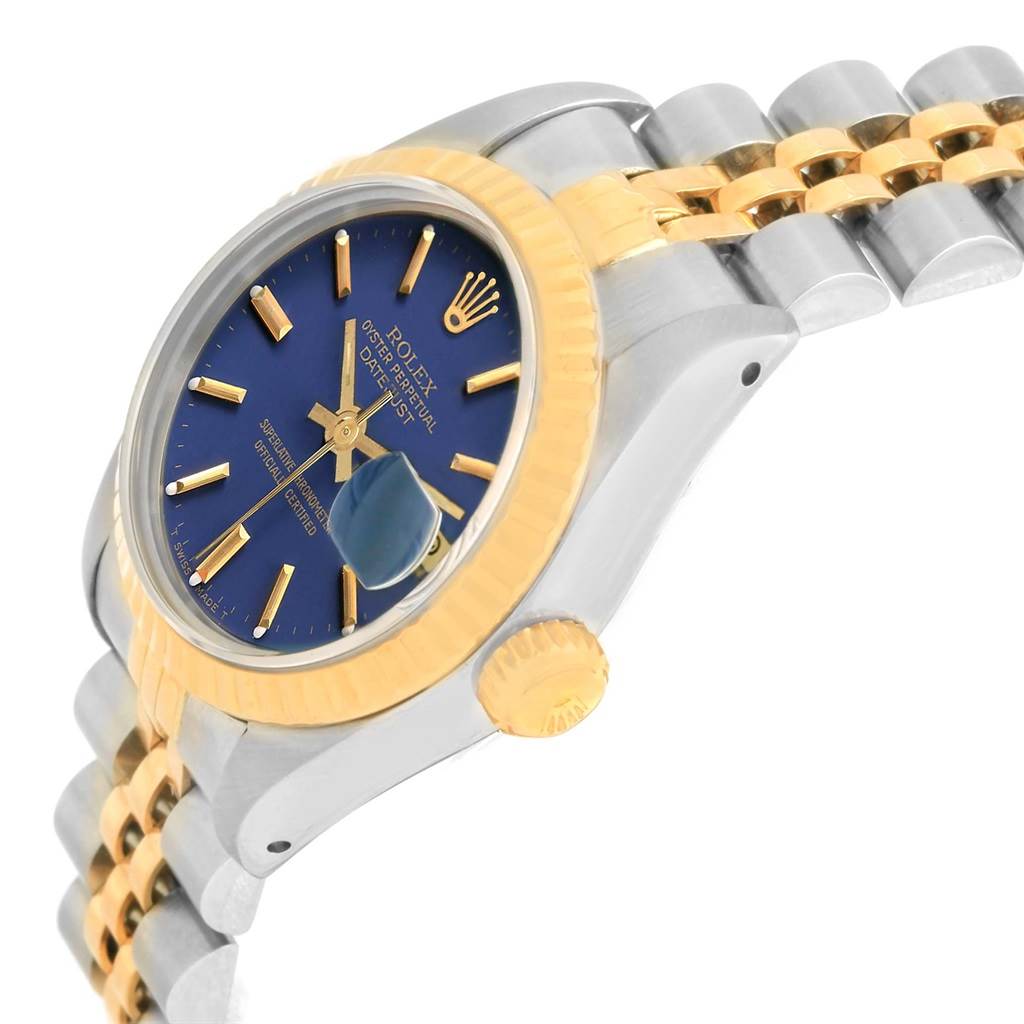 This image shows a side profile of the Rolex Datejust 69173 Women's Stainless Steel Blue Dial 69173 Women's Stainless Steel Blue Dial watch displaying its crown, bezel, and part of the bracelet.