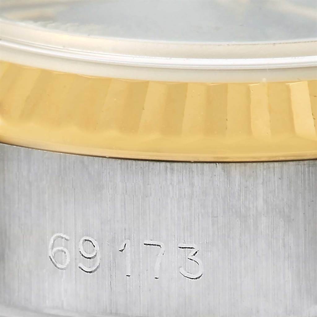 This close-up image shows part of the bezel, case, and engraved model number of a Rolex Datejust 69173 Women's Stainless Steel Blue Dial 69173 Women's Stainless Steel Blue Dial watch.