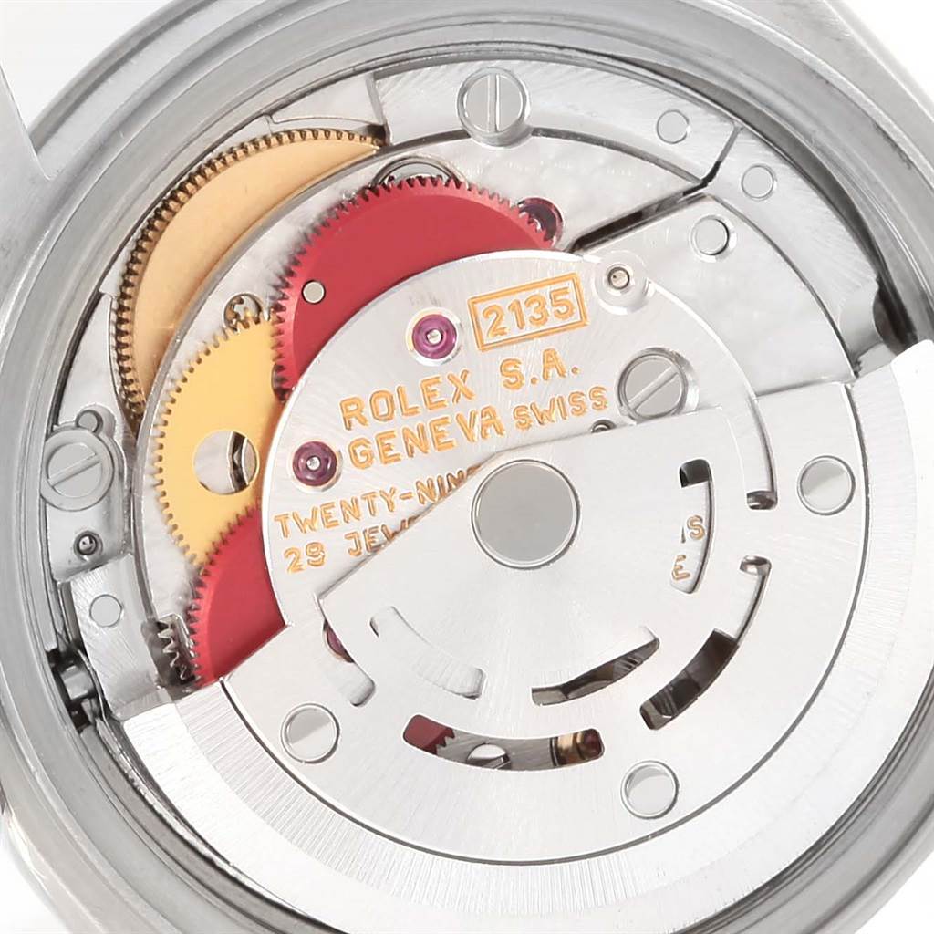 This image shows the internal movement mechanism of a Rolex Datejust 69174 Women's Stainless Steel Silver Dial 69174 Women's Stainless Steel Silver Dial watch, featuring gears and the rotor.