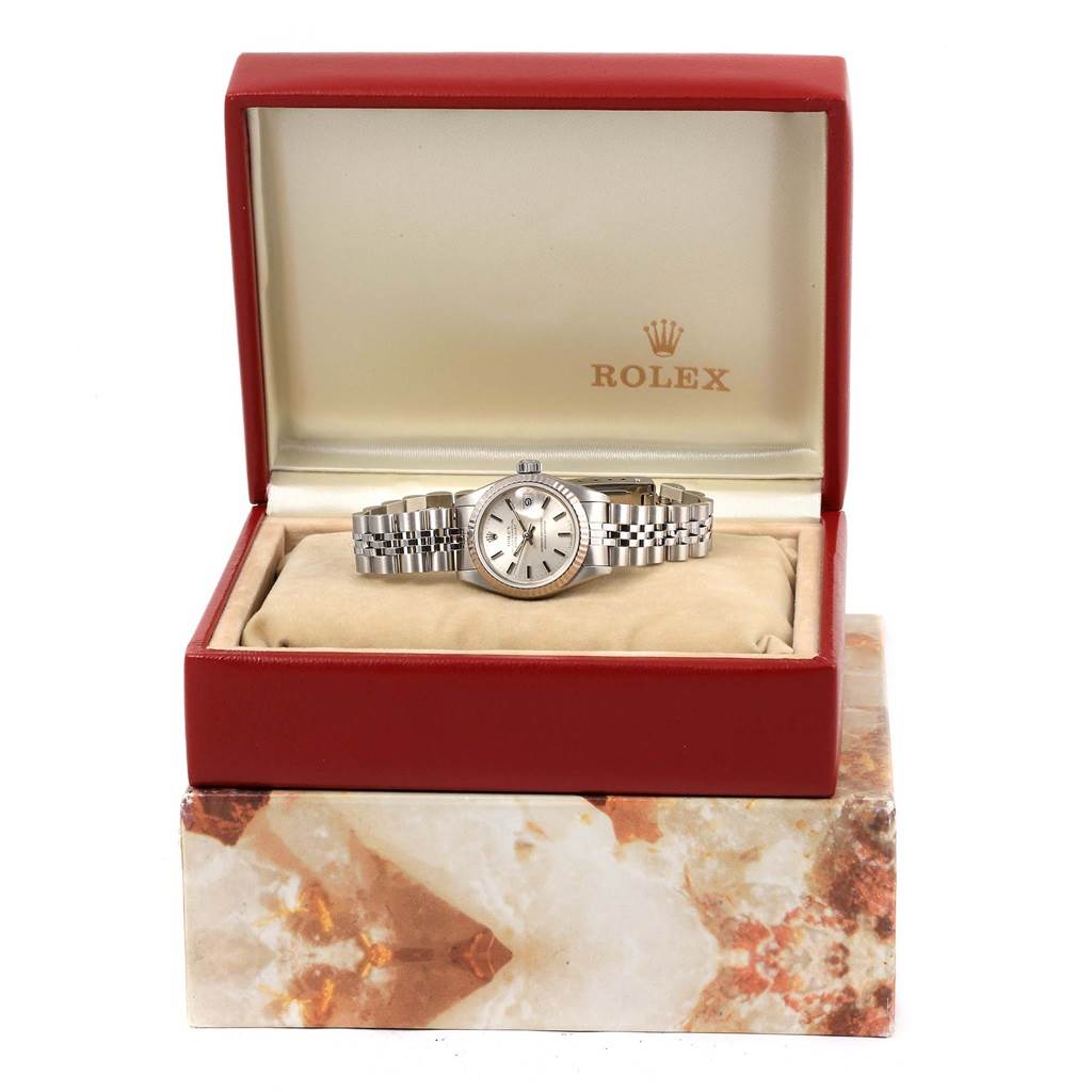The Rolex Datejust 69174 Women's Stainless Steel Silver Dial 69174 Women's Stainless Steel Silver Dial watch is displayed front-on, inside an open red Rolex box with its bracelet fully visible.