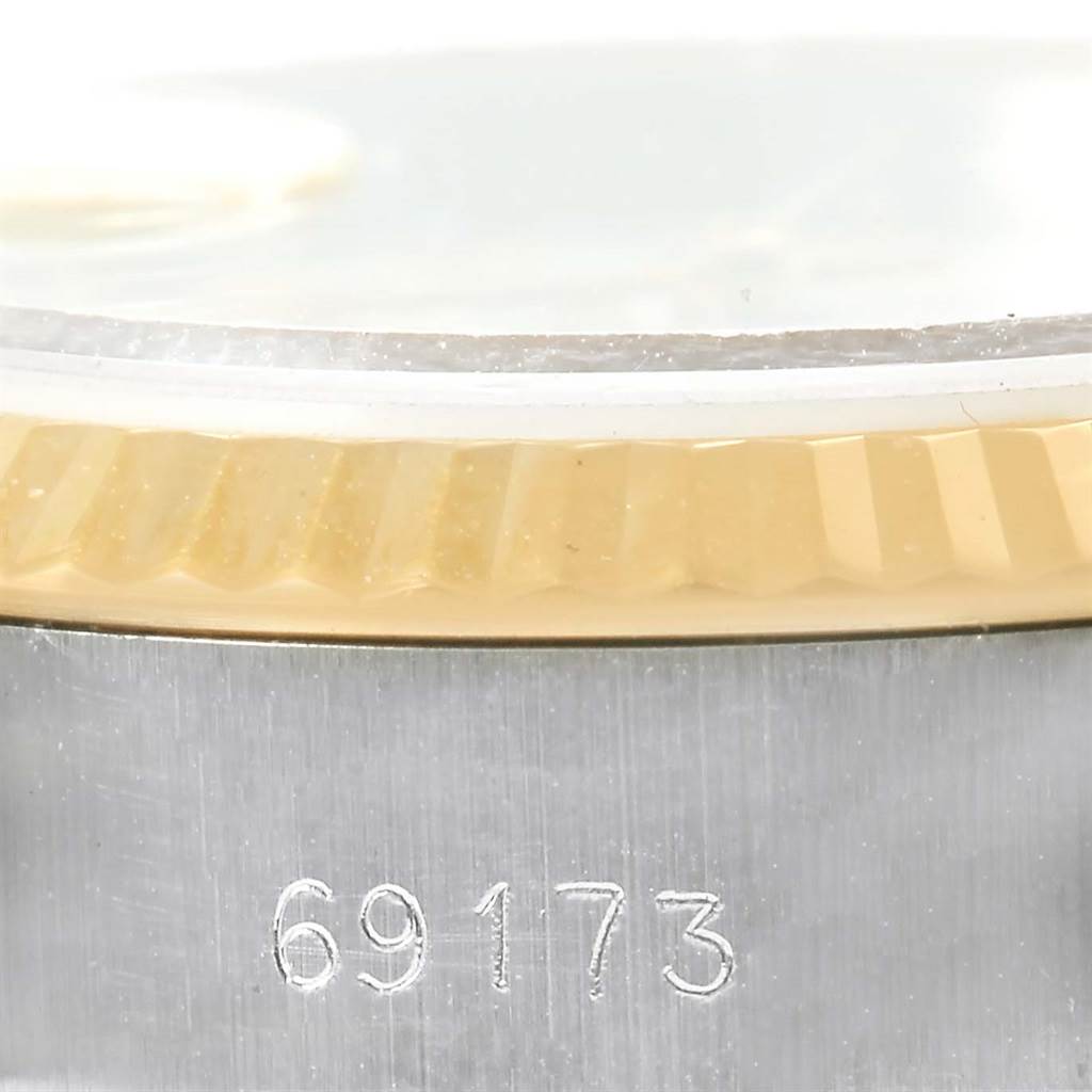 The image shows a close-up of a Rolex Datejust 69173 Women's Stainless Steel Beige Dial 69173 Women's Stainless Steel Beige Dial bezel and the model number "69173" on the case.