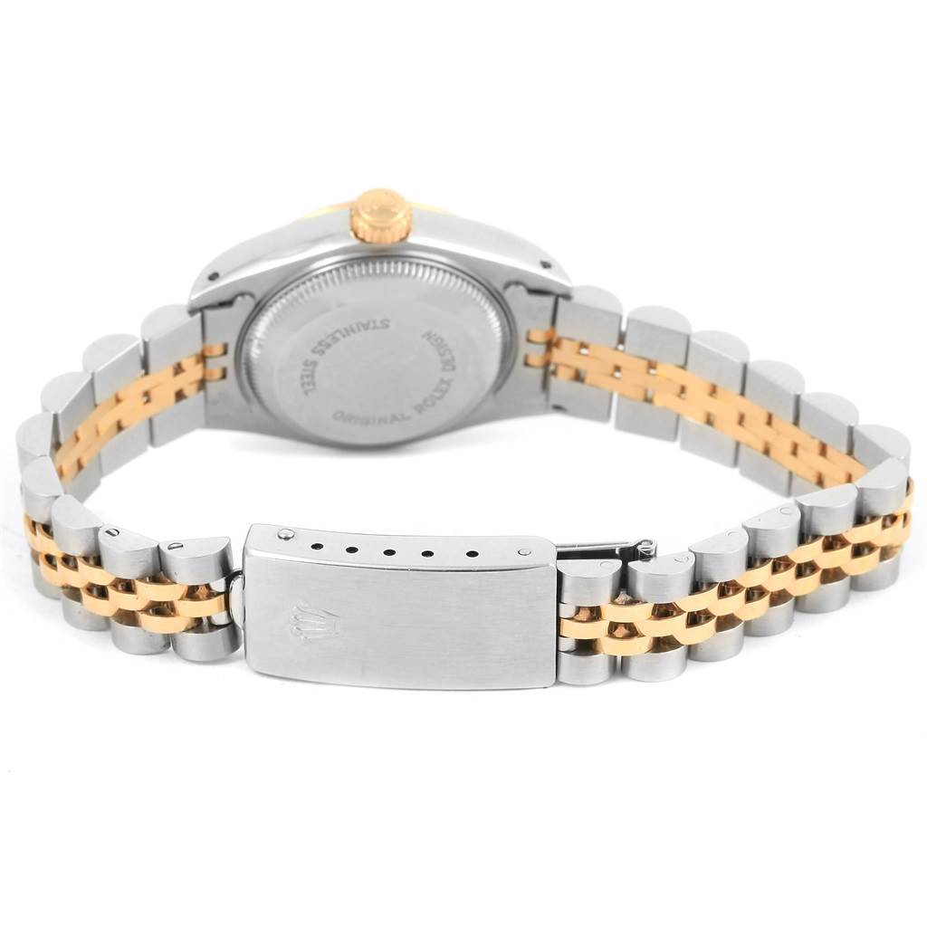 The image shows the back view of a Rolex Datejust 69173 Women's Stainless Steel Beige Dial 69173 Women's Stainless Steel Beige Dial watch, highlighting its stainless steel and gold bracelet and clasp.