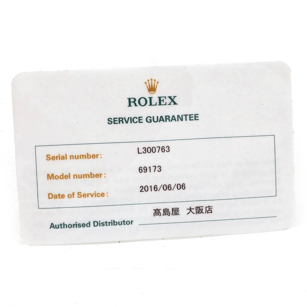 The image shows a Rolex Service Guarantee card for the Datejust model, featuring the serial and model numbers and the date of service.