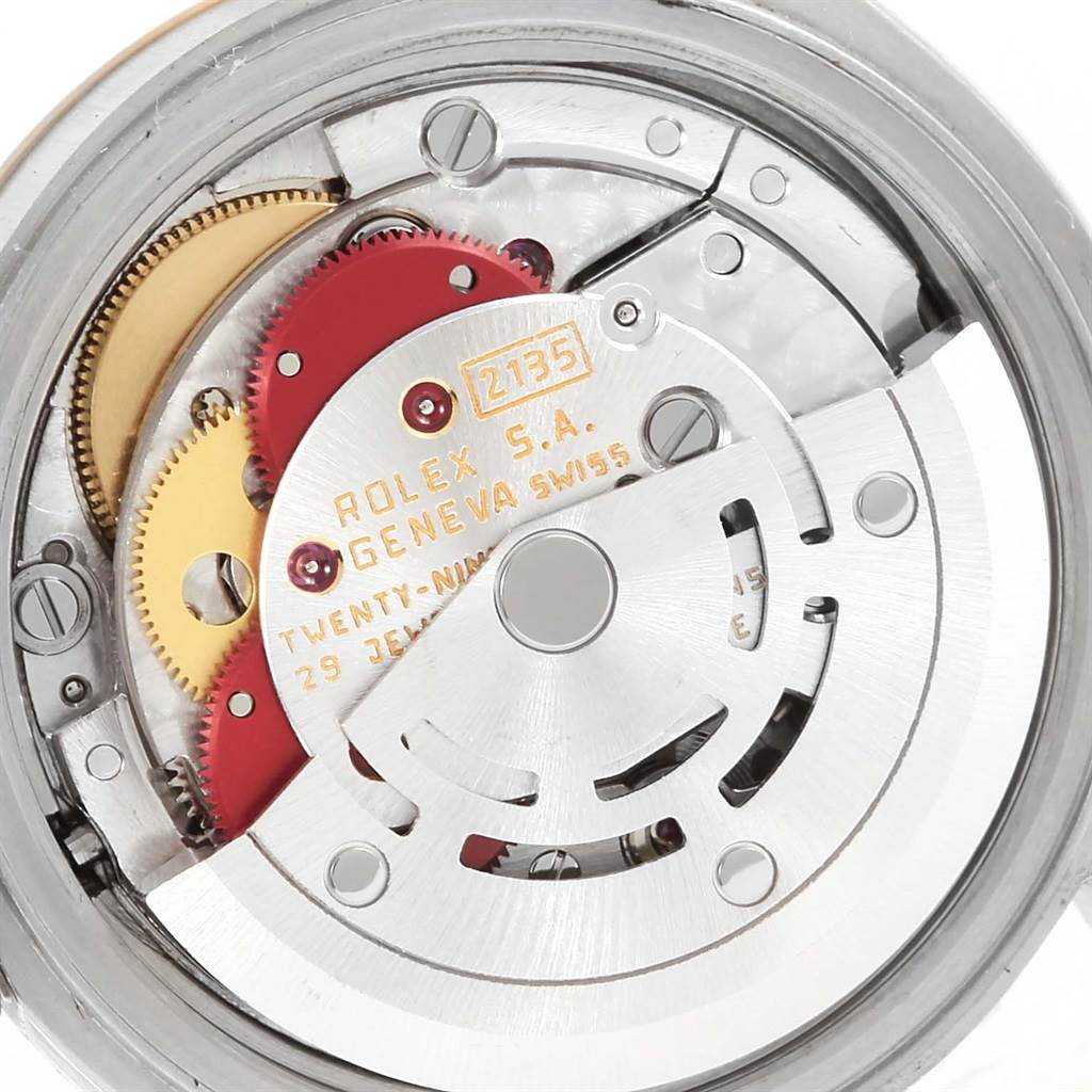 This image shows the internal mechanical movement of a Rolex Datejust 69173 Women's Stainless Steel Beige Dial 69173 Women's Stainless Steel Beige Dial watch, including gears and the rotor.