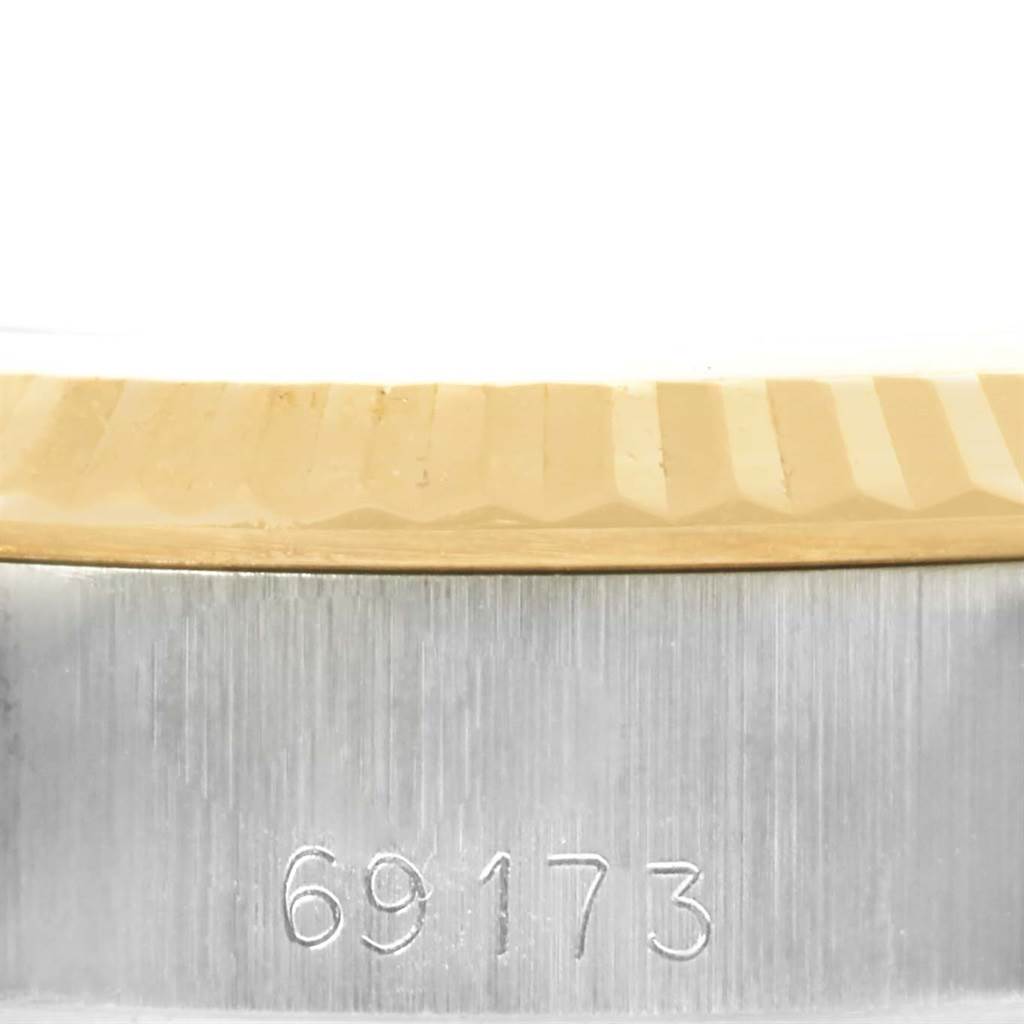 The image shows a close-up of the case side and fluted bezel of a Rolex Datejust 69173 Women's Stainless Steel Champagne Dial 69173 Women's Stainless Steel Champagne Dial, including the model number 69173.