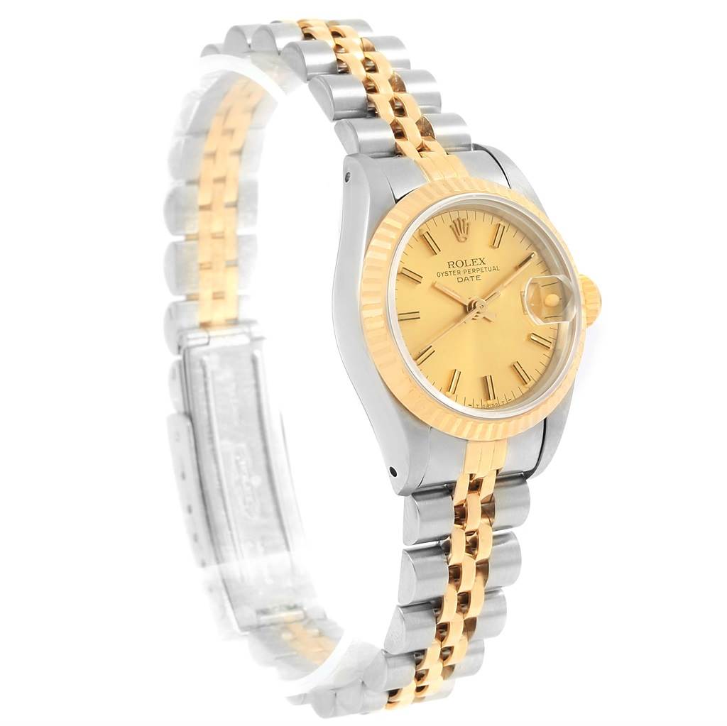The Rolex Datejust 69173 Women's Stainless Steel Champagne Dial 69173 Women's Stainless Steel Champagne Dial model watch is shown at a slight angle, highlighting its gold dial, two-tone bracelet, and fluted bezel.