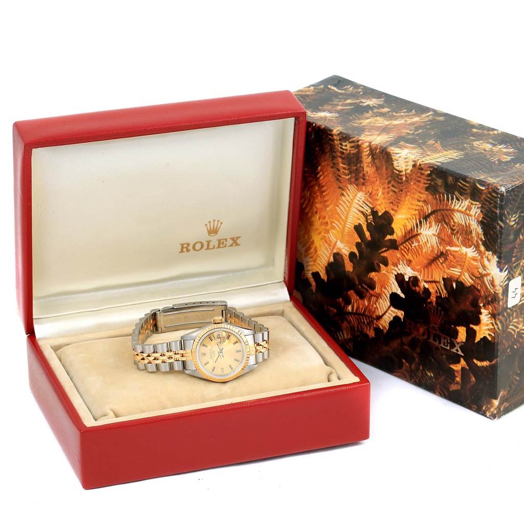 The image shows a Rolex Datejust 69173 Women's Stainless Steel Champagne Dial 69173 Women's Stainless Steel Champagne Dial watch in an open red display case with a decorative outer box beside it.