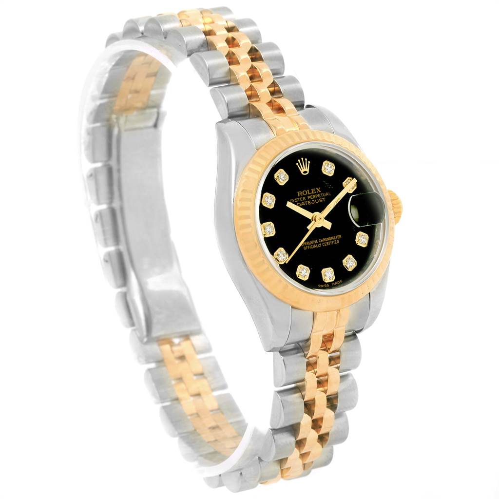 The image shows a side-angle view of a Rolex Datejust 179173 Women
s Steel and Gold (two tone) Black Dial 179173 Women
s Steel and Gold (two tone) Black Dial watch showcasing its two-tone bracelet and black dial with diamond hour markers.