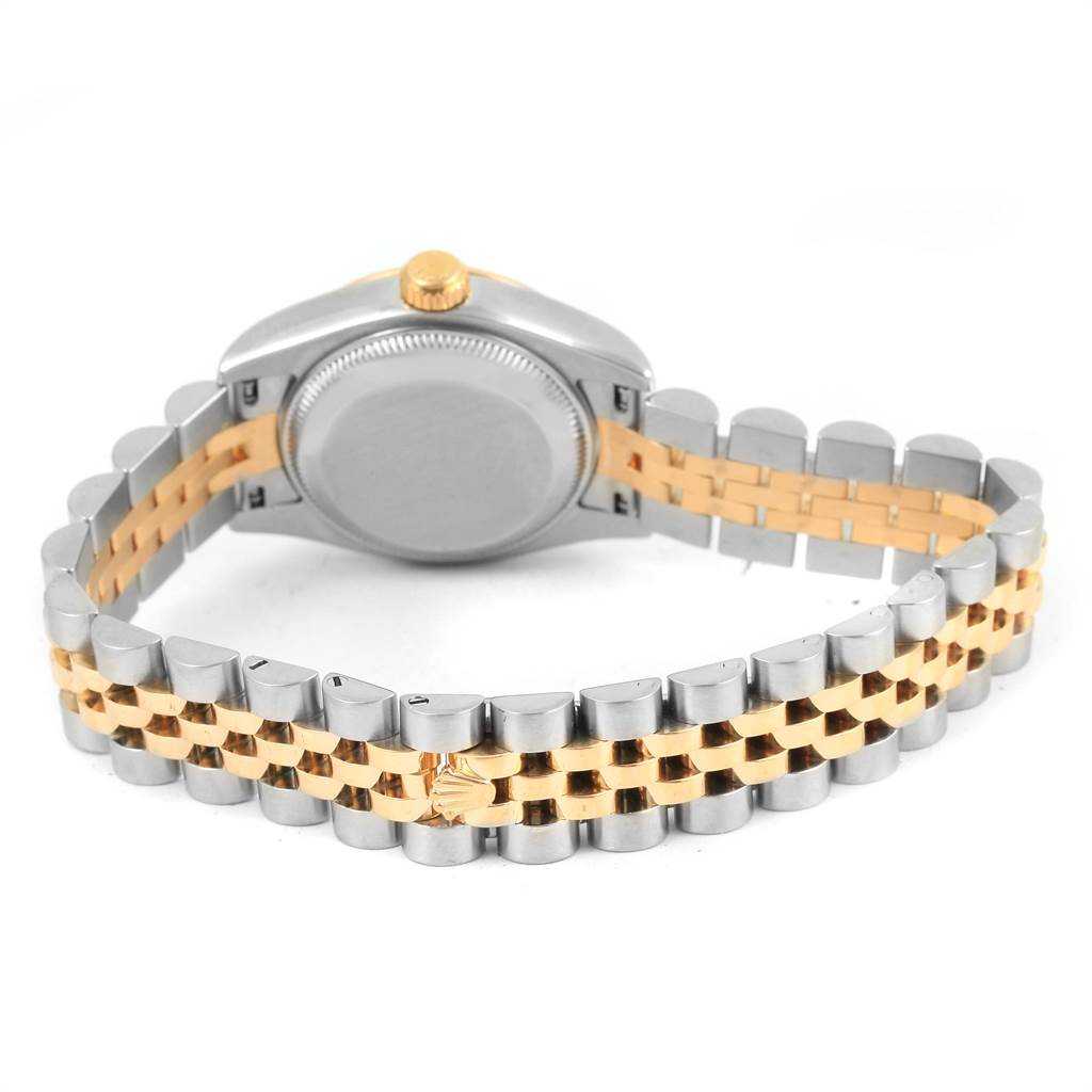 The Rolex Datejust 179173 Women
s Steel and Gold (two tone) Black Dial 179173 Women
s Steel and Gold (two tone) Black Dial watch is shown from the back, displaying its case back and the two-tone jubilee bracelet.