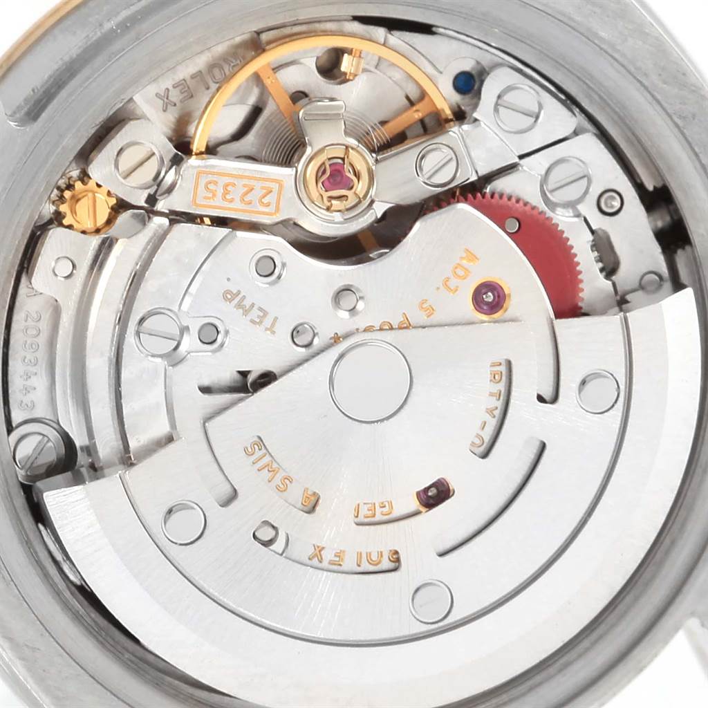 This image shows a close-up view of the internal mechanism of a Rolex Datejust 179173 Women
s Steel and Gold (two tone) Black Dial 179173 Women
s Steel and Gold (two tone) Black Dial watch, displaying its intricate components.