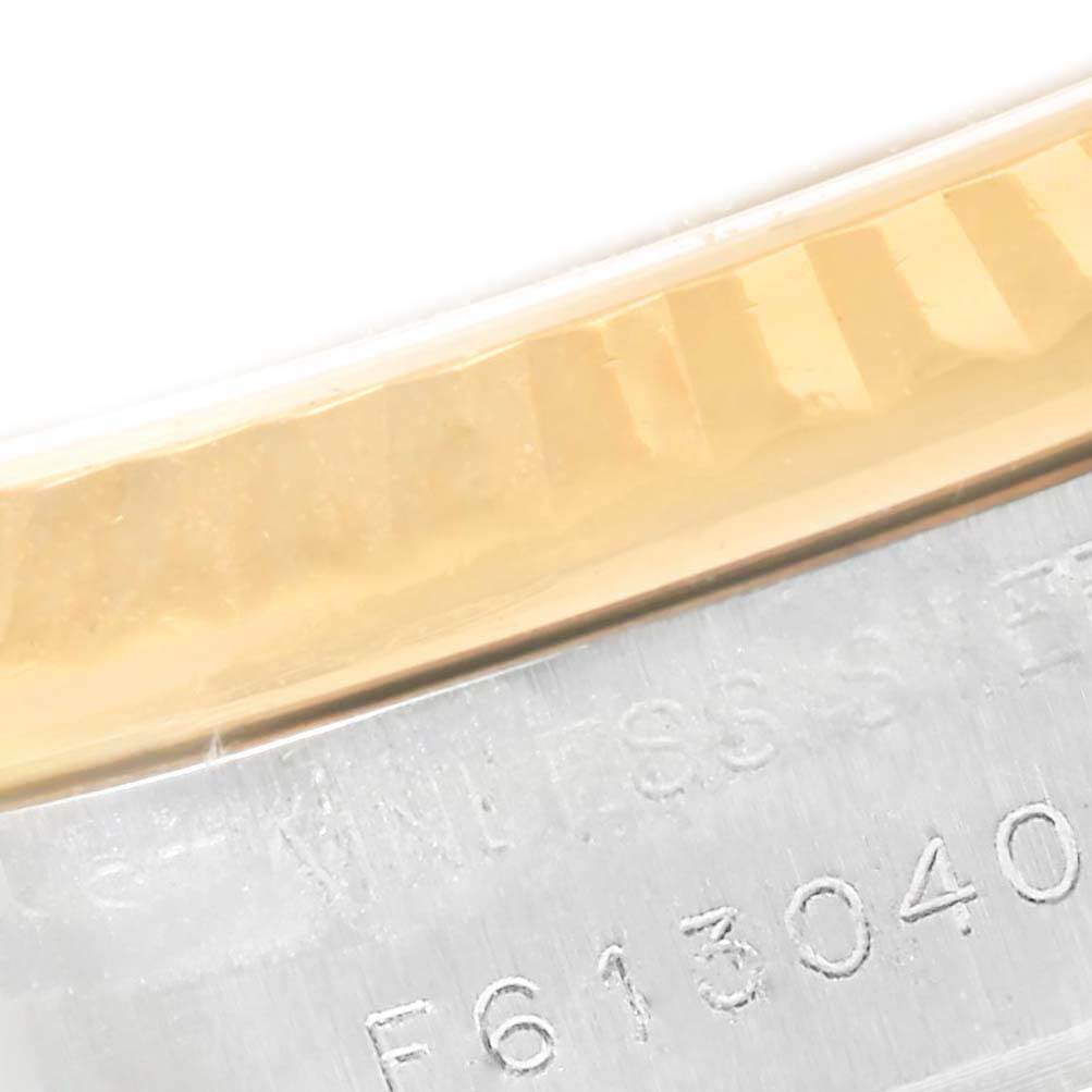 This close-up of a Rolex Datejust 179173 Women's Steel and Gold (two tone) White Dial 179173 Women's Steel and Gold (two tone) White Dial watch shows the edge of the bezel and part of the case with a visible reference number.