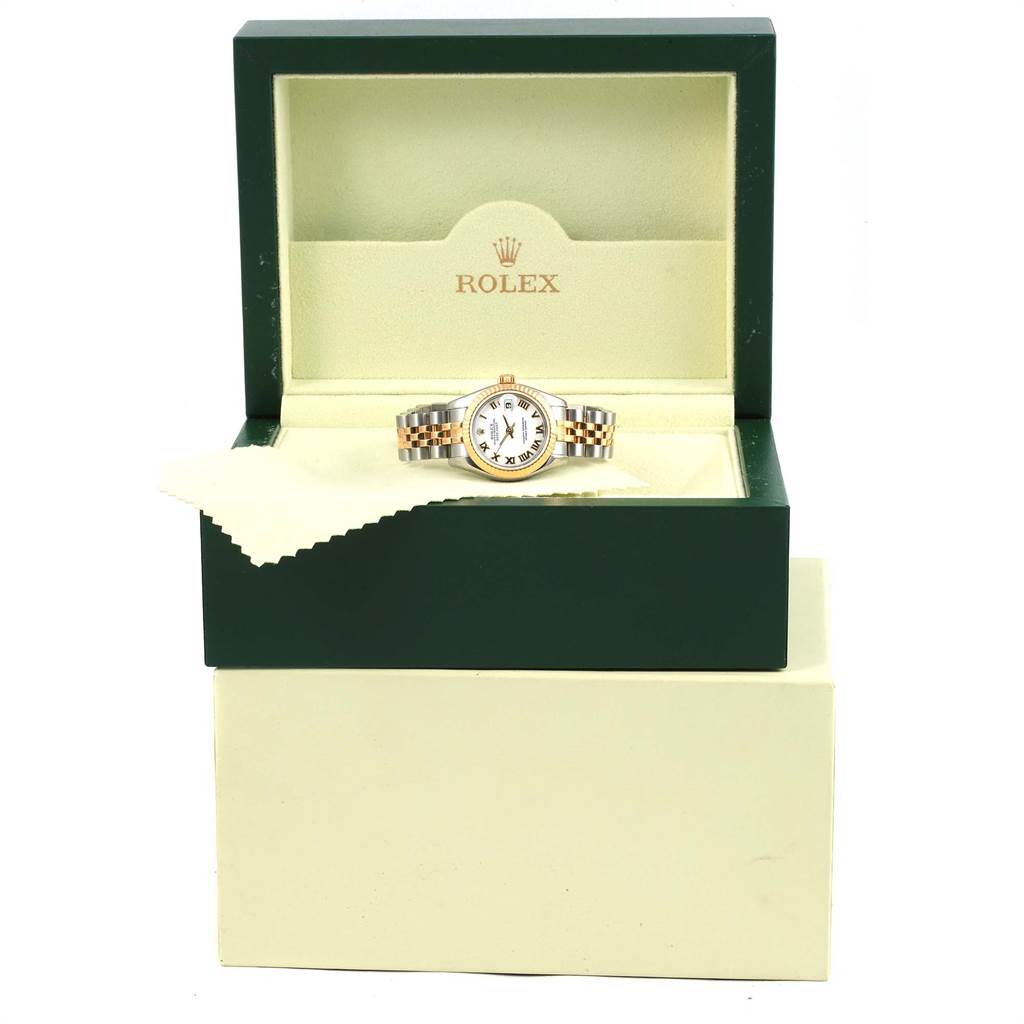 The Rolex Datejust 179173 Women's Steel and Gold (two tone) White Dial 179173 Women's Steel and Gold (two tone) White Dial watch is shown from the front, inside its open green and cream display box.