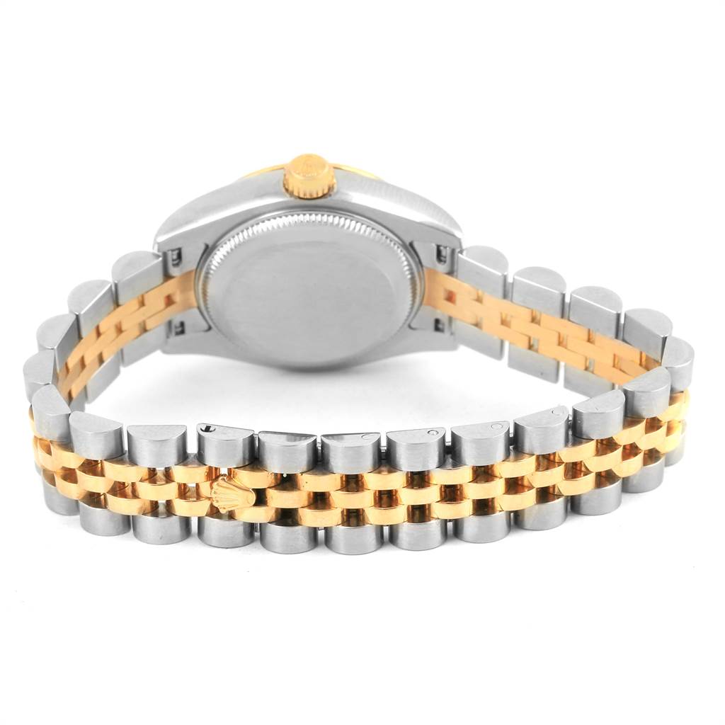 This photo of the Rolex Datejust 179173 Women's Steel and Gold (two tone) White Dial 179173 Women's Steel and Gold (two tone) White Dial watch shows the back case and bi-metal bracelet from a rear angle.