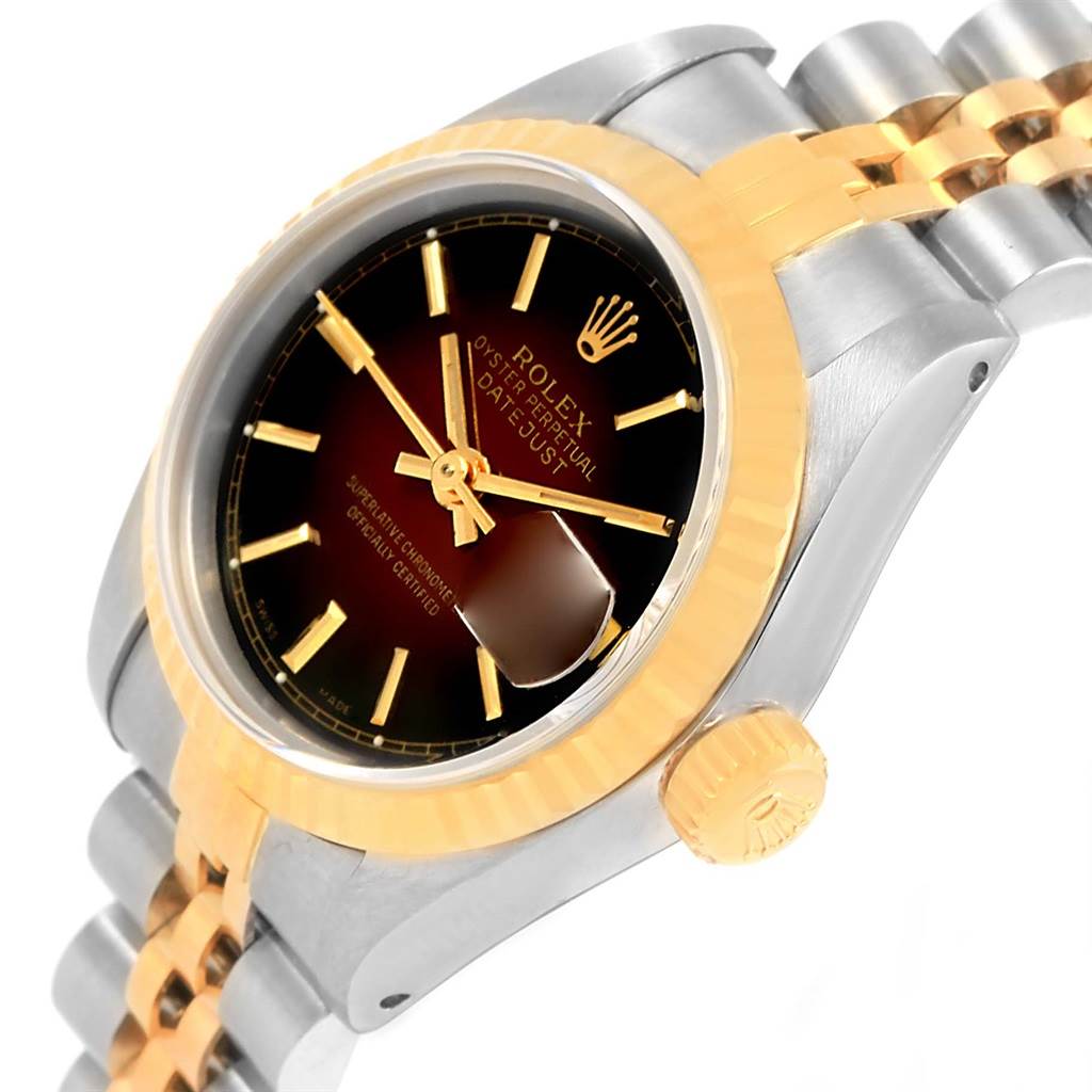 The image showcases a close-up, angled view of a Rolex Datejust 69173 Women's Stainless Steel Brown Dial 69173 Women's Stainless Steel Brown Dial watch, highlighting the face, crown, and a portion of the bracelet.
