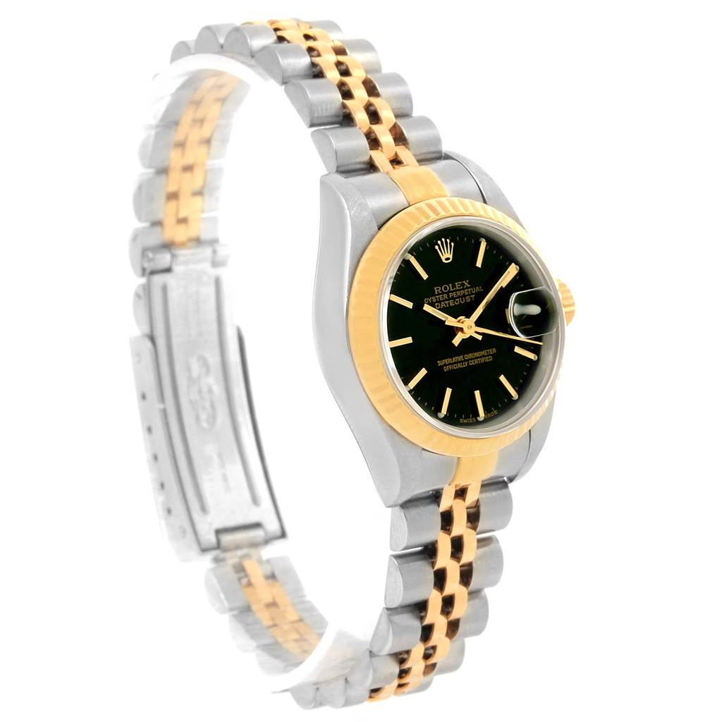 This image shows a Rolex Datejust 79173 Women's Steel and Gold (two tone) Black Dial 79173 Women's Steel and Gold (two tone) Black Dial watch angled to display the face and a portion of the two-tone bracelet.