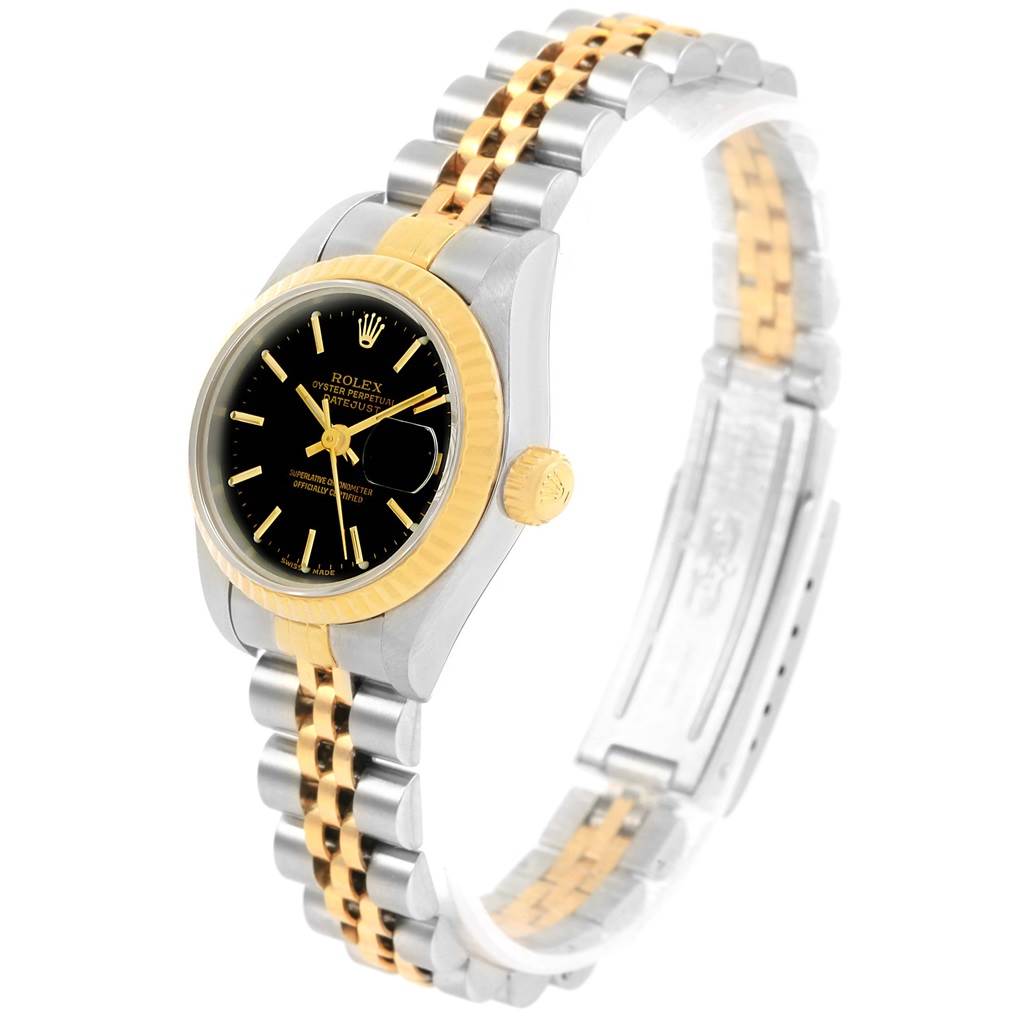 This image shows a side angle of the Rolex Datejust 79173 Women's Steel and Gold (two tone) Black Dial 79173 Women's Steel and Gold (two tone) Black Dial watch, highlighting its black dial, gold bezel, and two-tone bracelet.