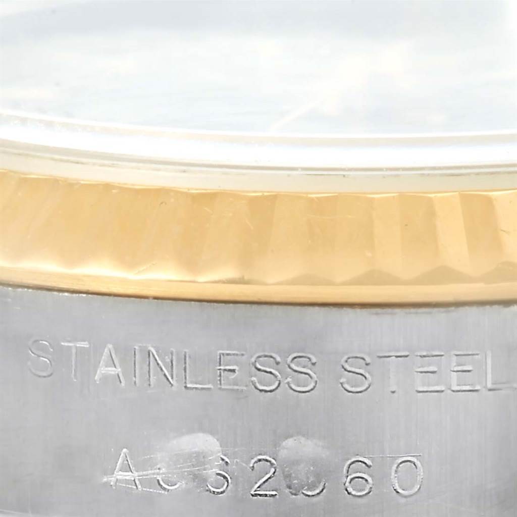 The image shows a close-up of the bezel and case side with the engraving on a Rolex Datejust 79173 Women's Steel and Gold (two tone) Black Dial 79173 Women's Steel and Gold (two tone) Black Dial watch.