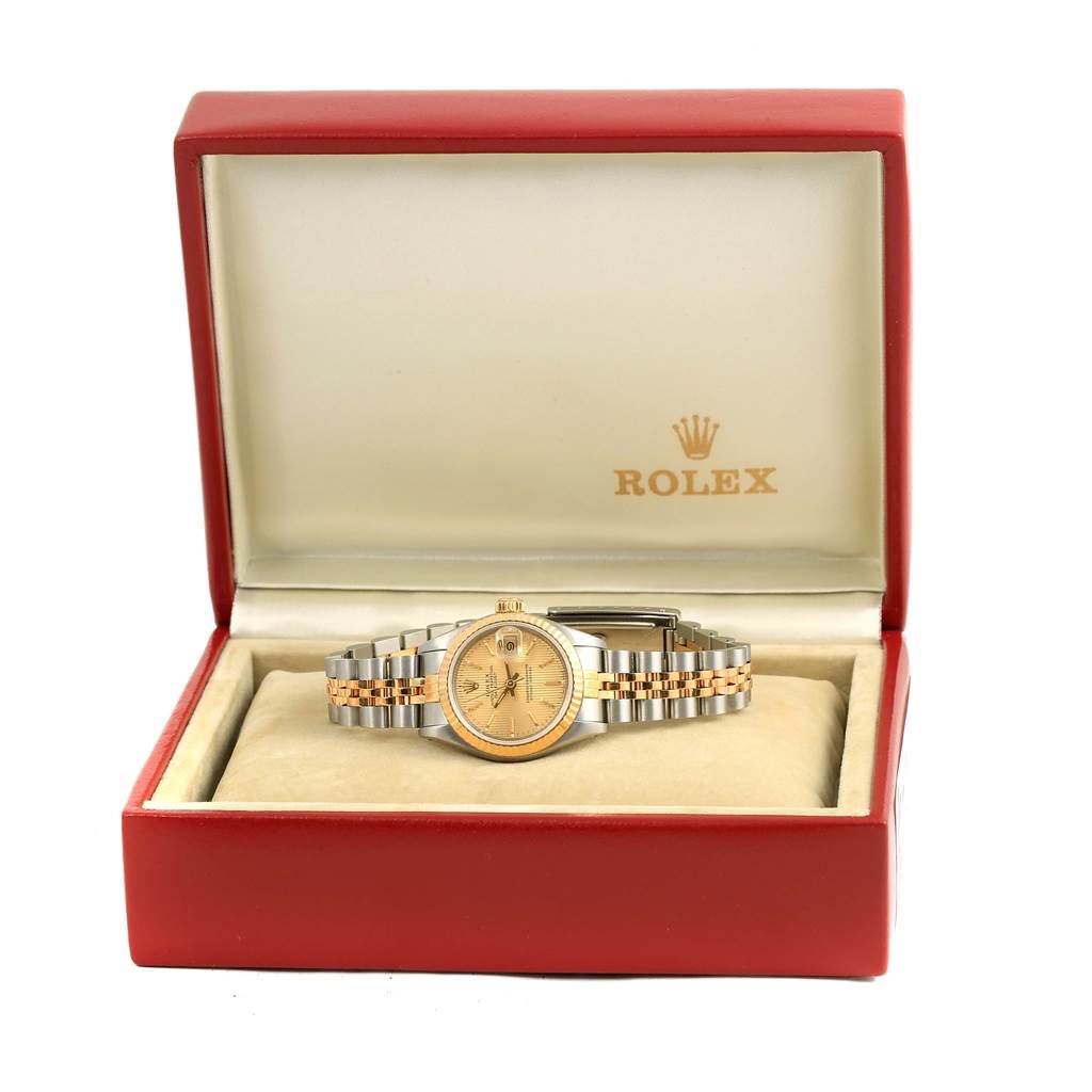 The Rolex Datejust 69173 Women's Stainless Steel Champagne Dial 69173 Women's Stainless Steel Champagne Dial watch is shown from the front, displayed in an open red box with a two-tone bracelet visible.
